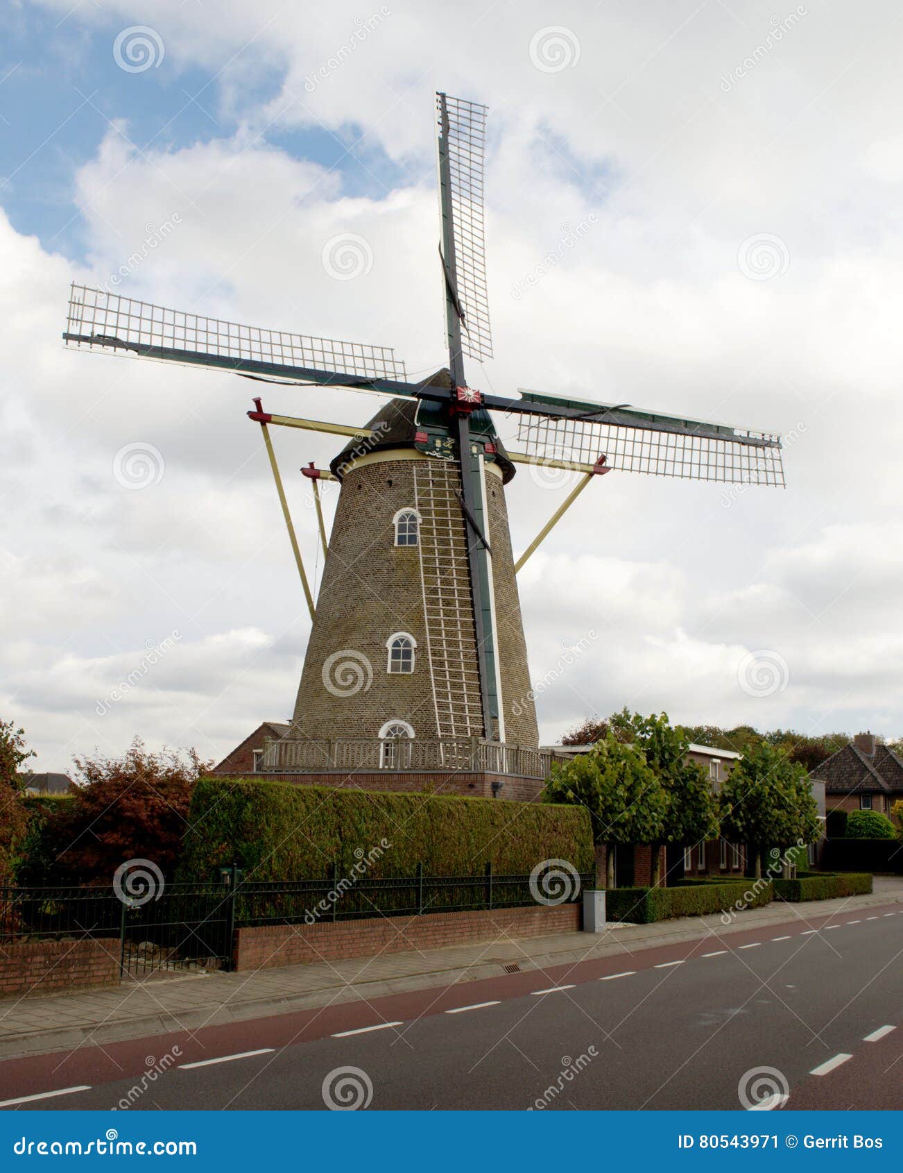 Corn mill besides a road stock image. Image of blue, road 80543971