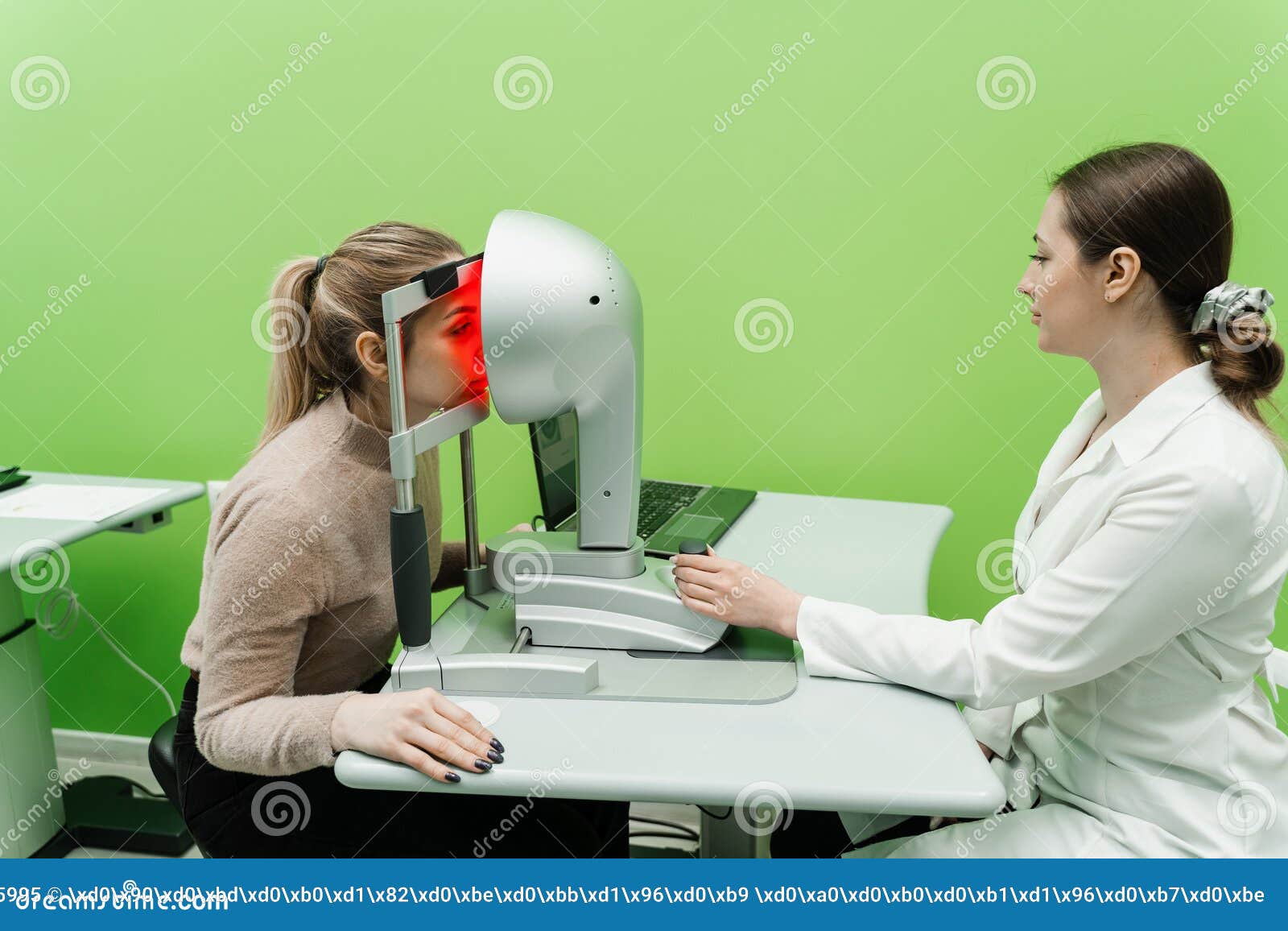 corneal topography eye vision test for visual description of the  and power of the cornea. optometrist is scanning