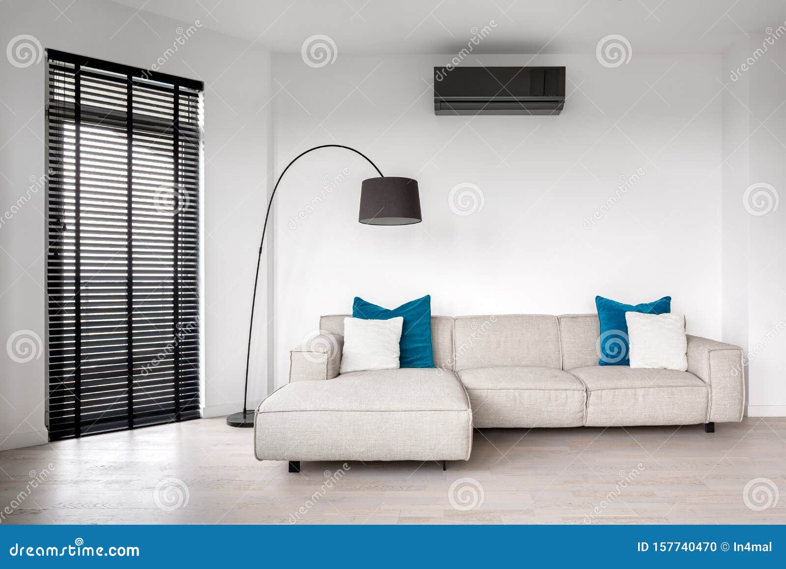 beige sofa with blue pillows