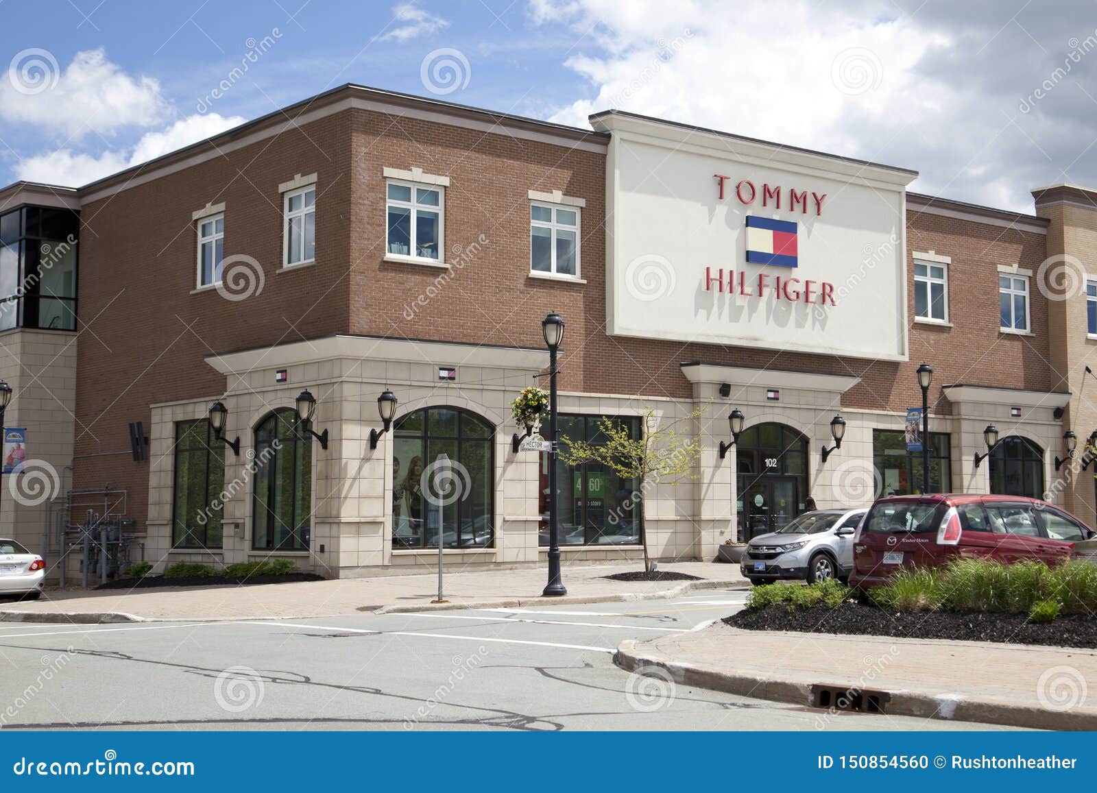 Corner View of Tommy Hilfiger Outlet Store in Dartmouth Editorial Image - Image of company, gate: