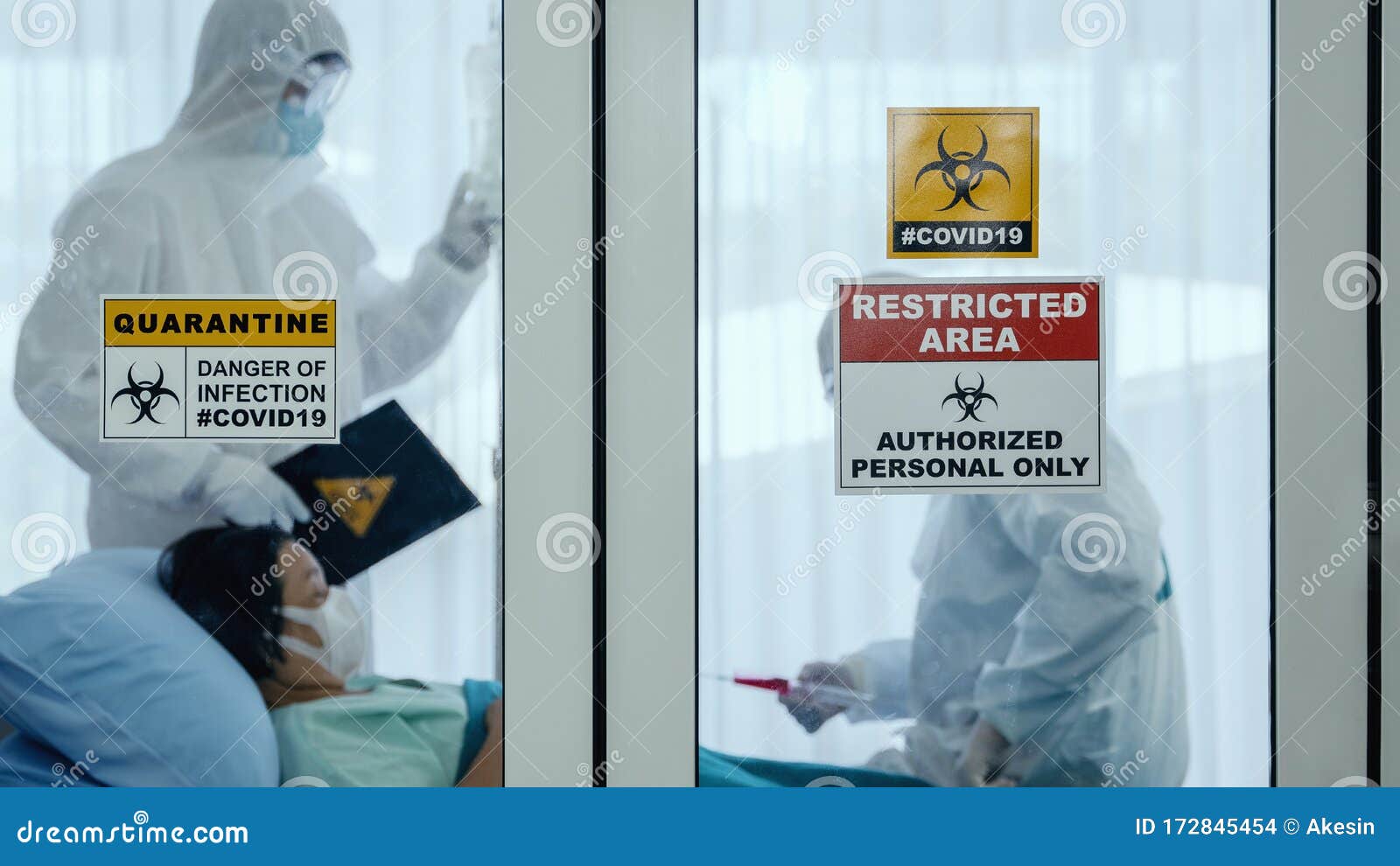 coronavirus covid-19 quarantine and breakout alert sign on window of quarantine room at hospital with disease control experts try