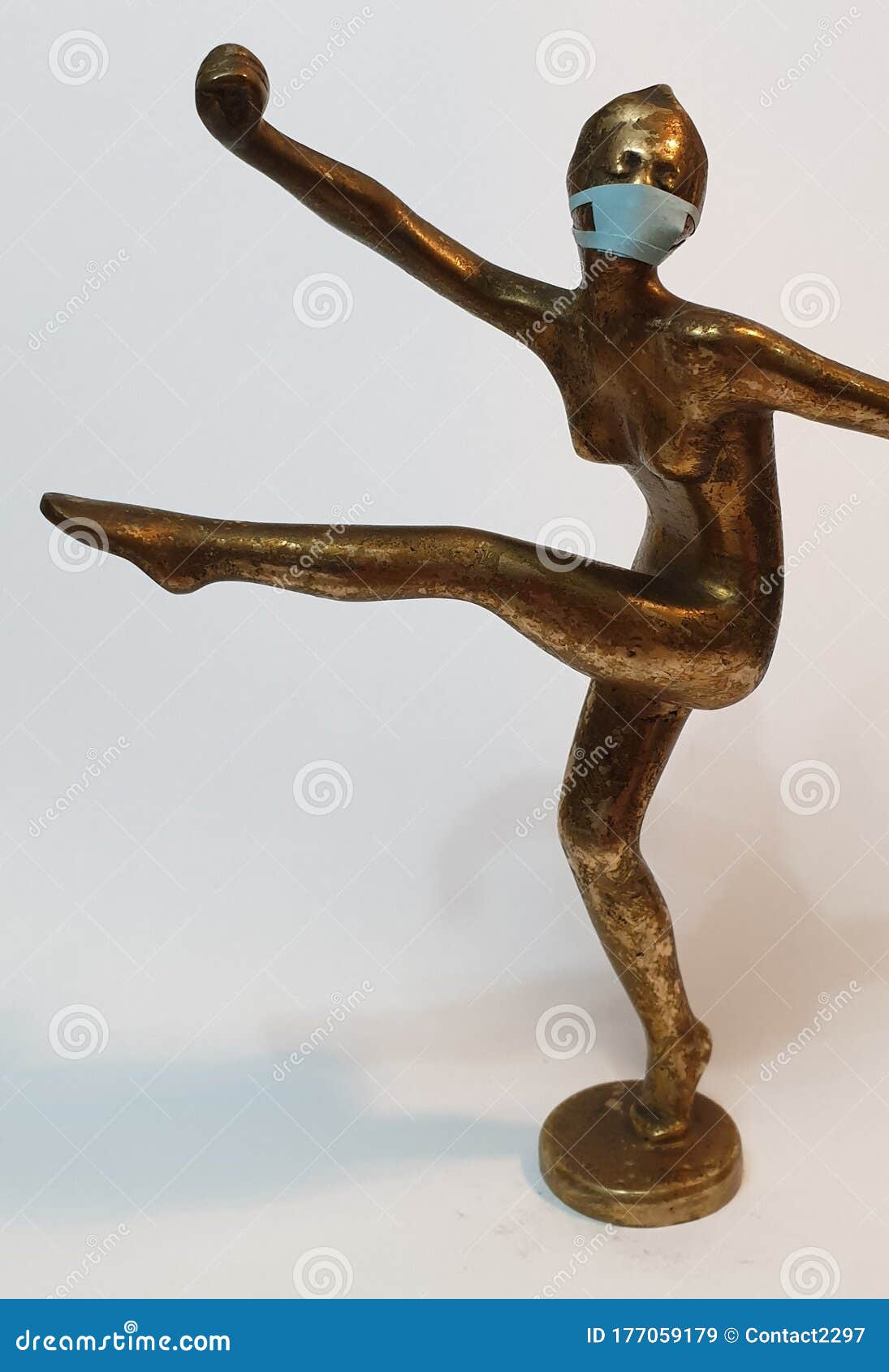 coronavirus metaphore vintage brass statue dancer girl