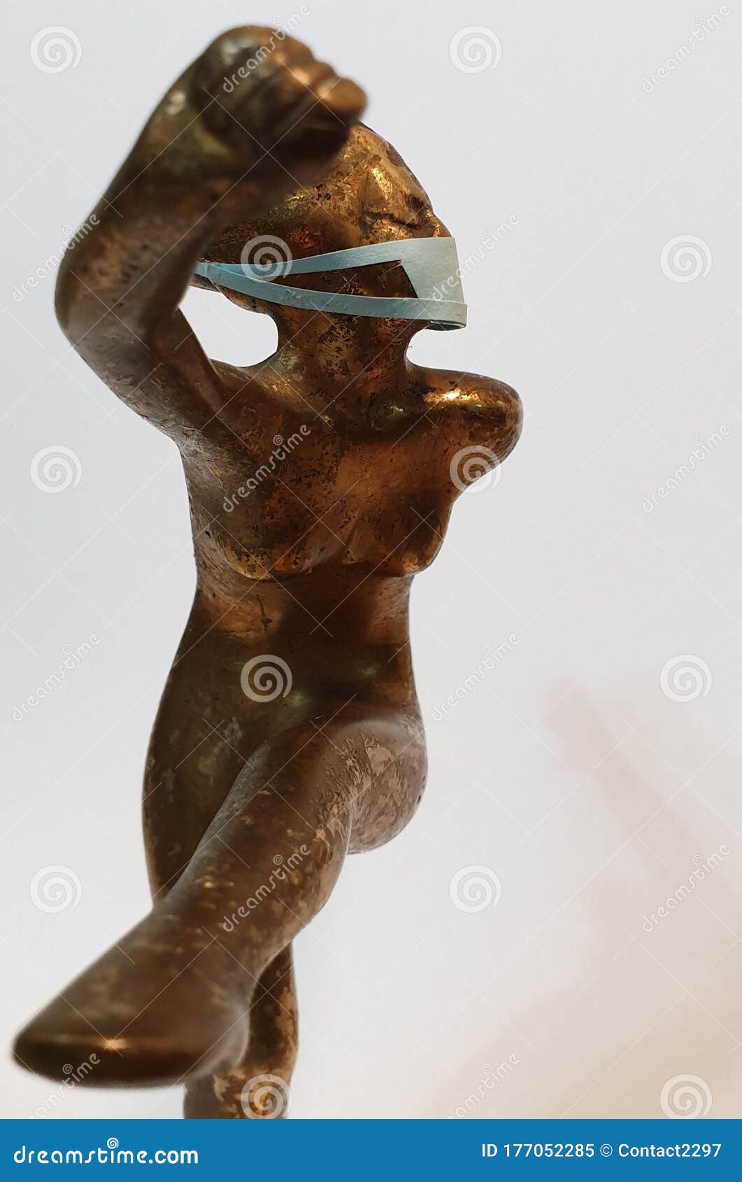 coronavirus metaphore vintage brass statue dancer girl