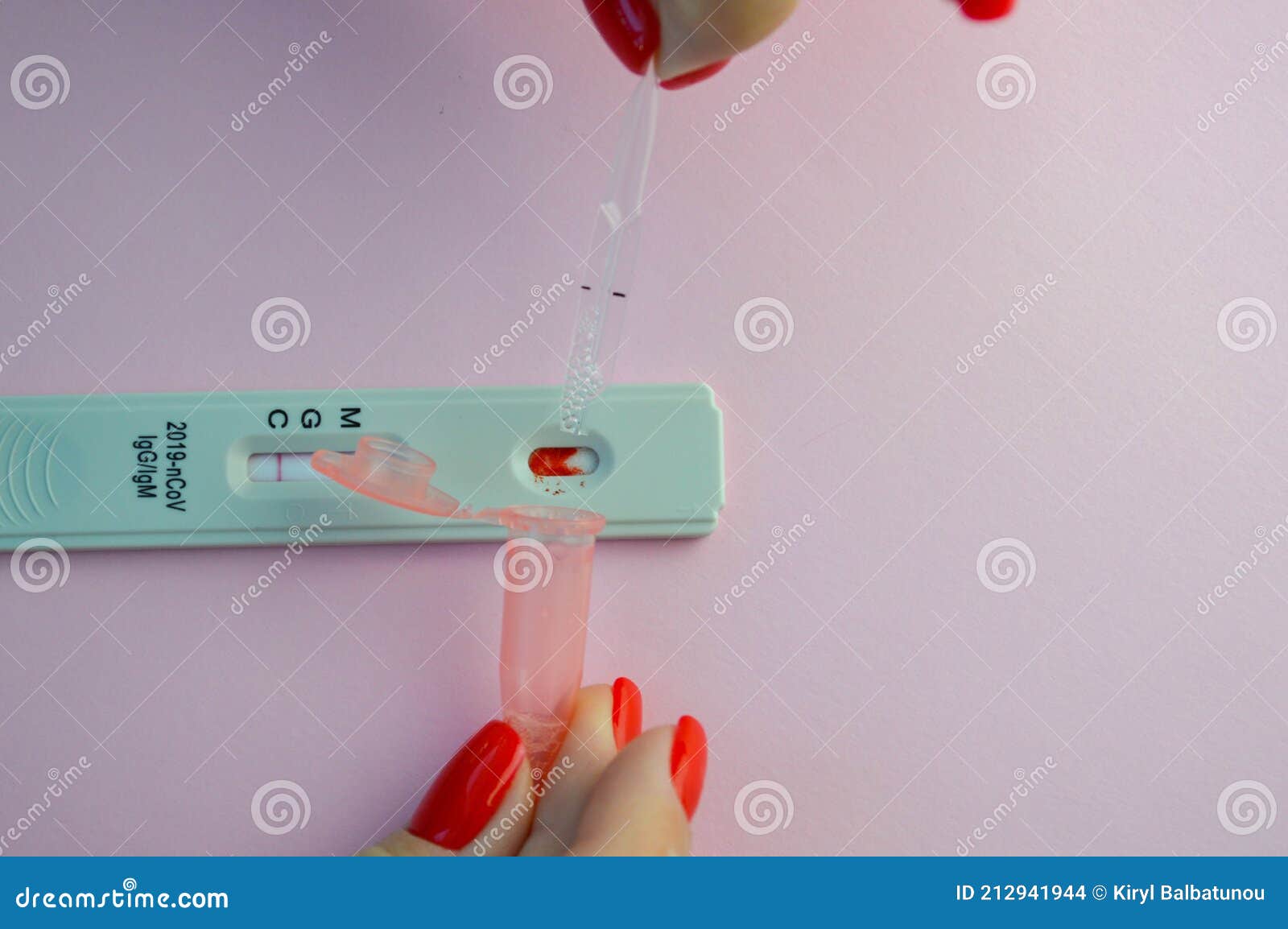 coronavirus test on a pink matte background. medical procedure. a physical solution is collected in a special container to