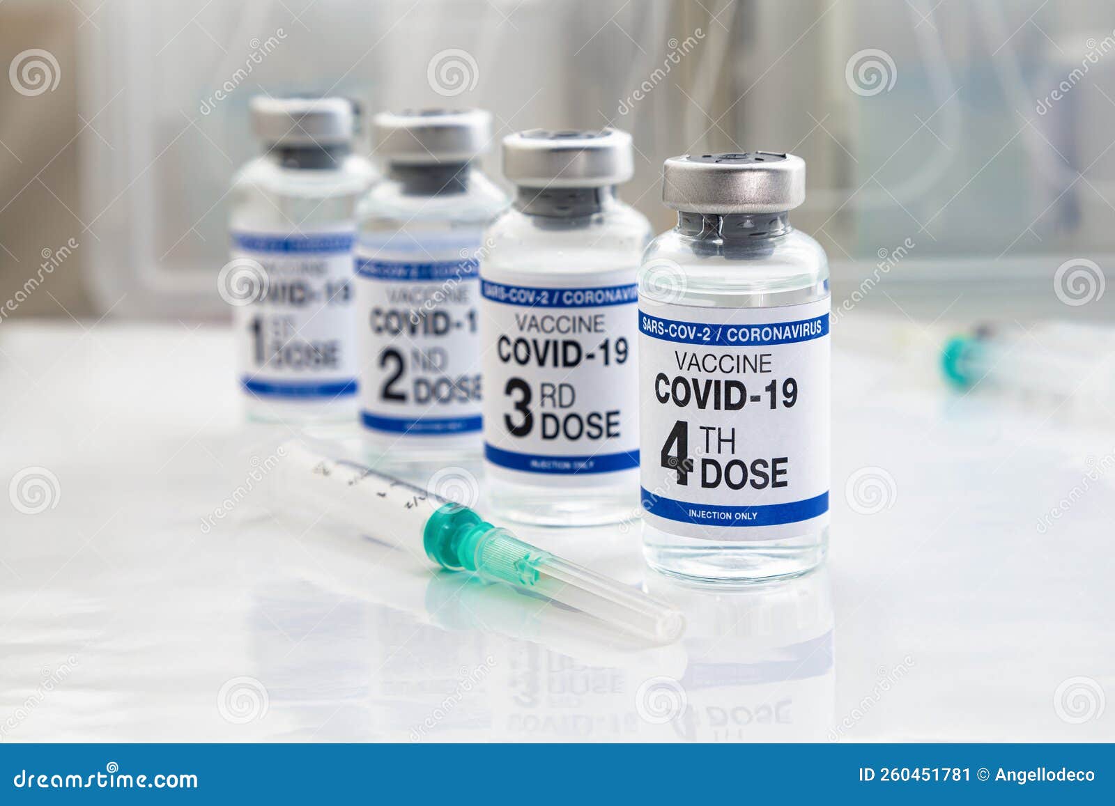 covid-19 vaccine vials for vaccination labeled with 1st, 2nd, 3rd and 4th doses for booster shot against omicron variants