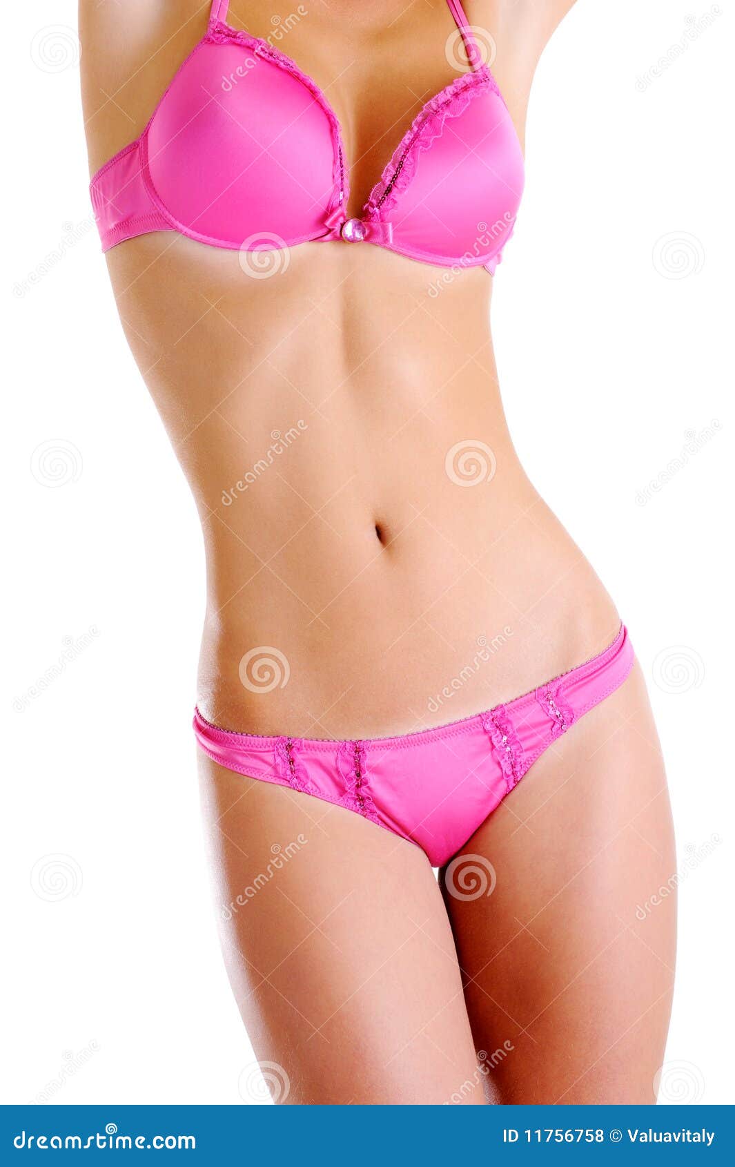 Corpo fêmea nu bonito perfeito. Aperfeiçoe o corpo fêmea nu bonito em uma roupa interior cor-de-rosa. Vista dianteira. Em um fundo branco