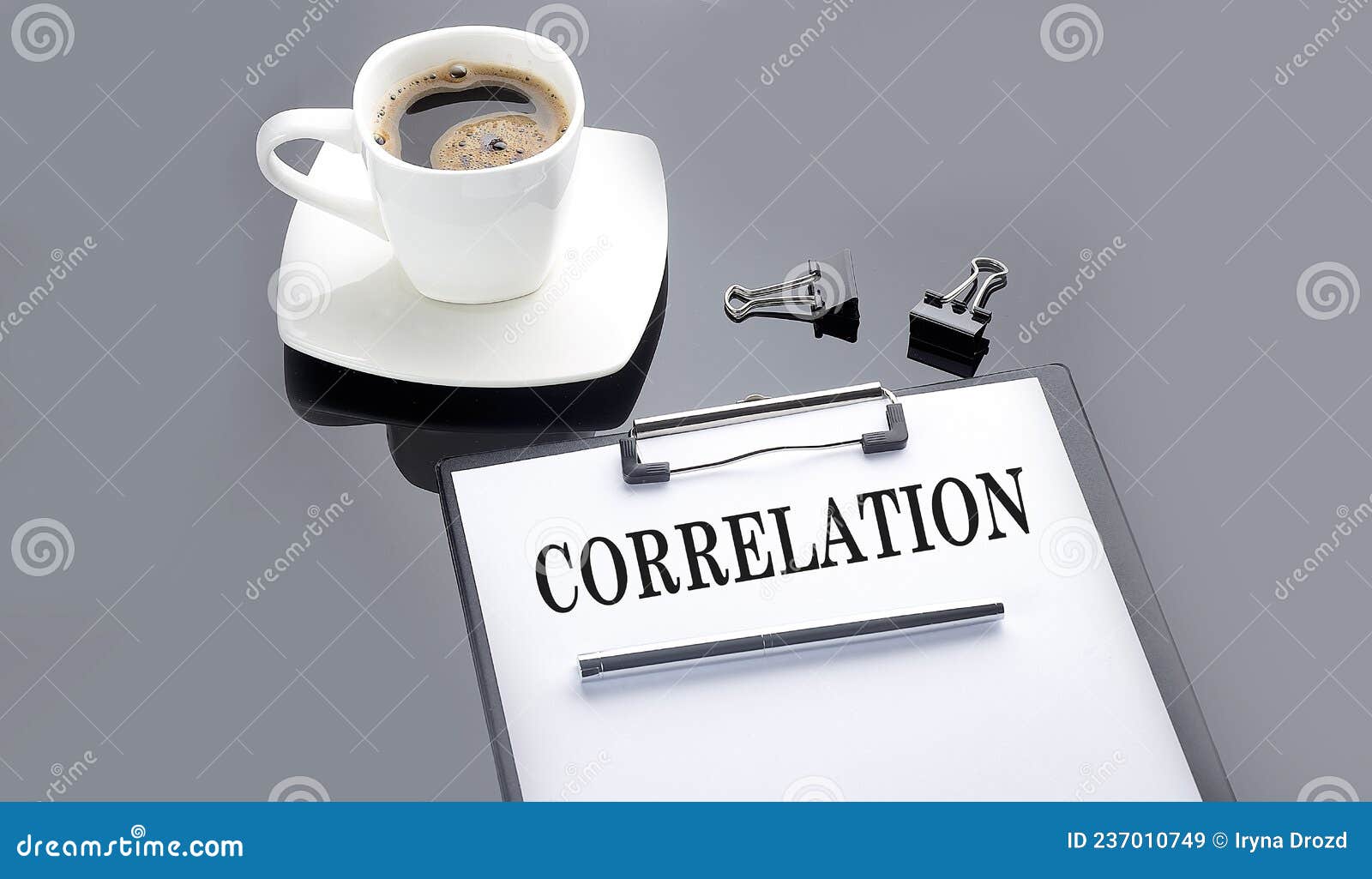 correlation text on paper sheet with coffee on the black background