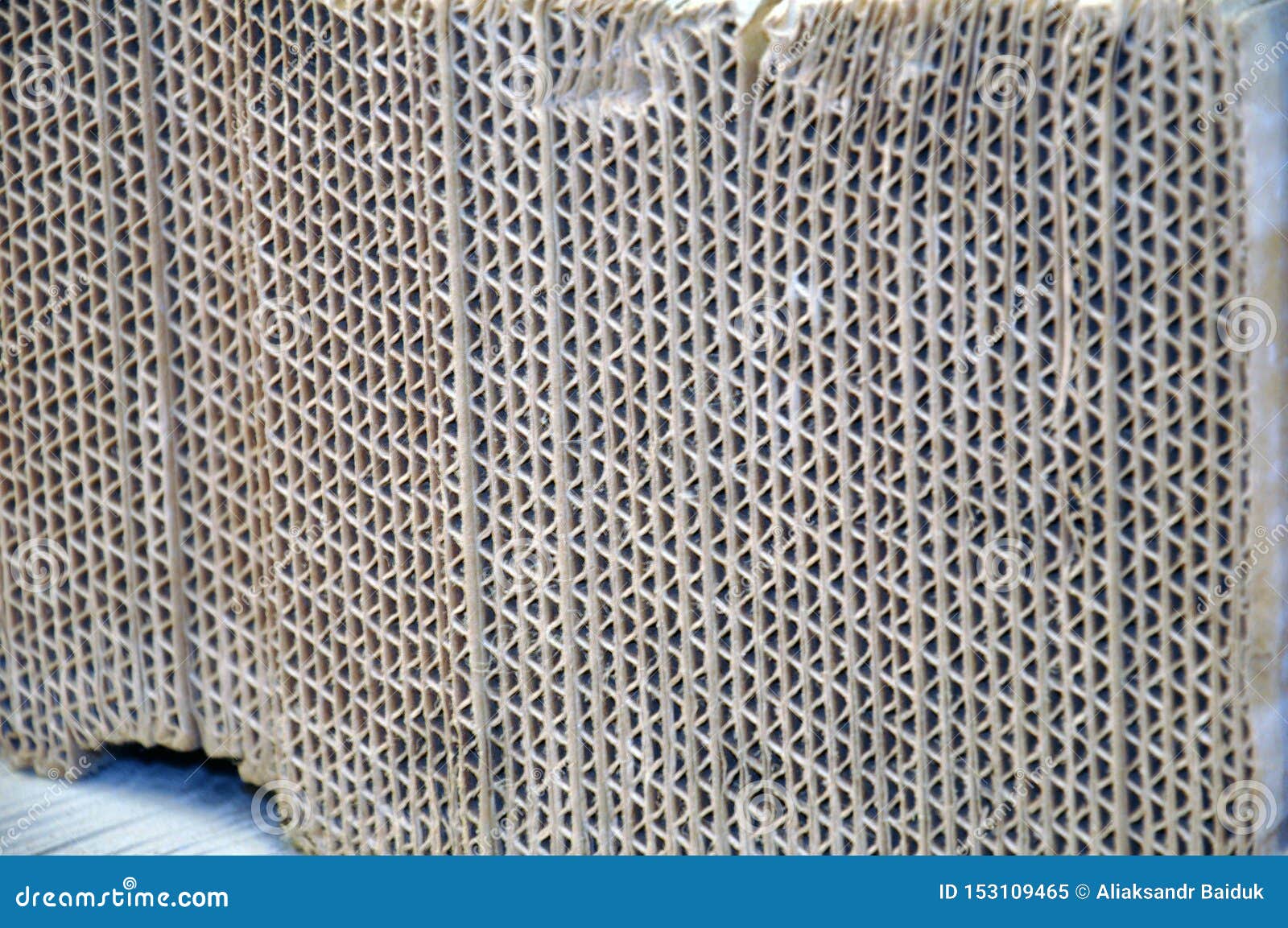 Corrugated Cardboard Sheets One by One, they are Prepared for Packing Metal Structures Stock