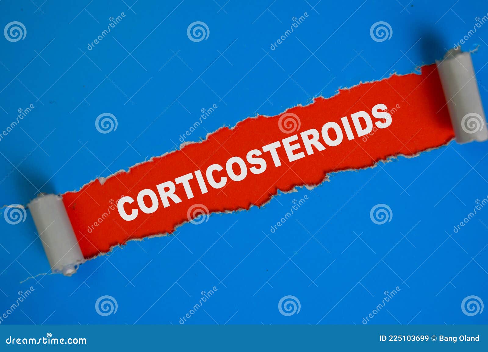 corticosteroids text written in torn paper
