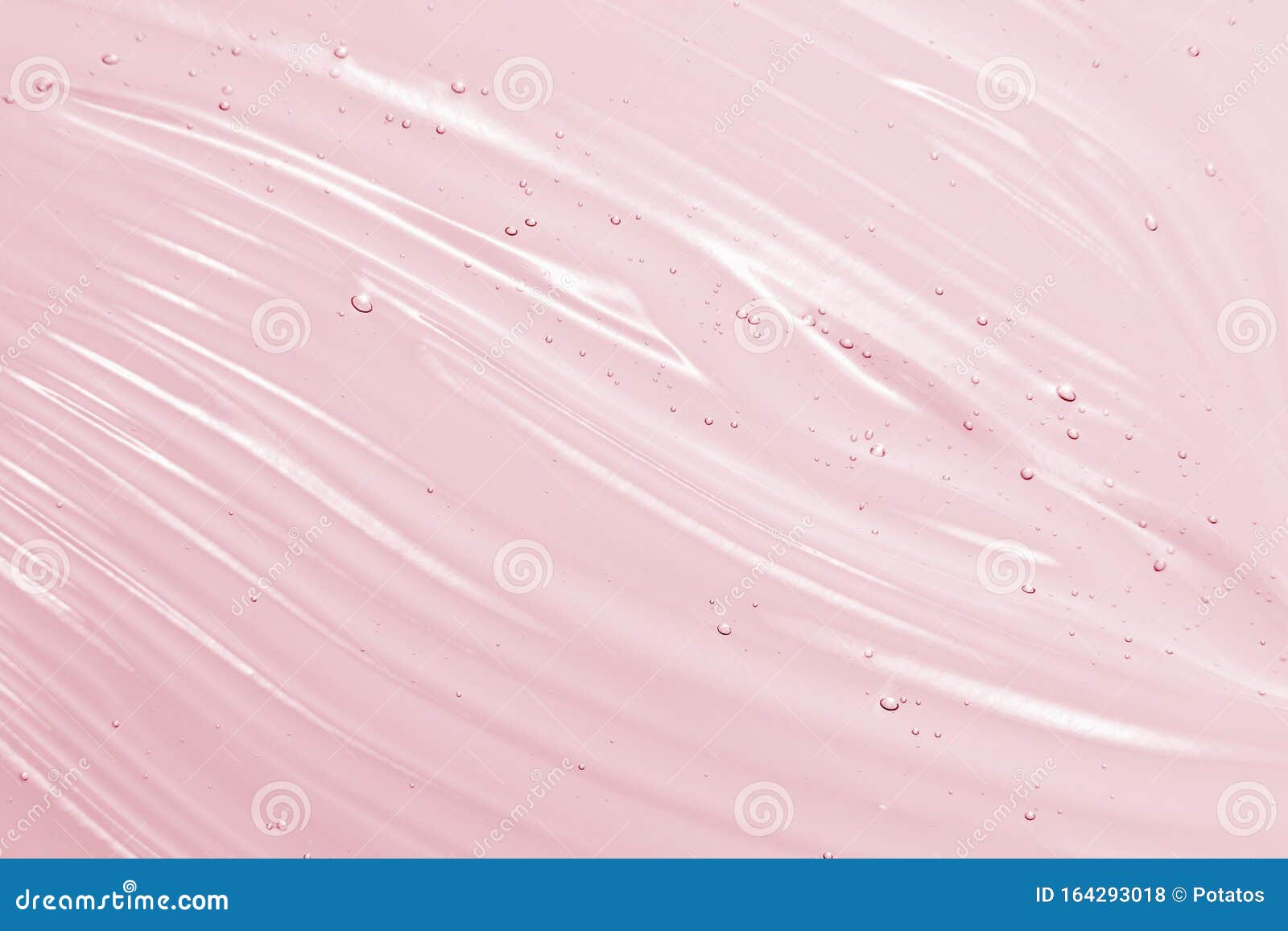 cosmetic gel background. face serum, clear beauty cream texture. pink colored transparent skincare product close-up