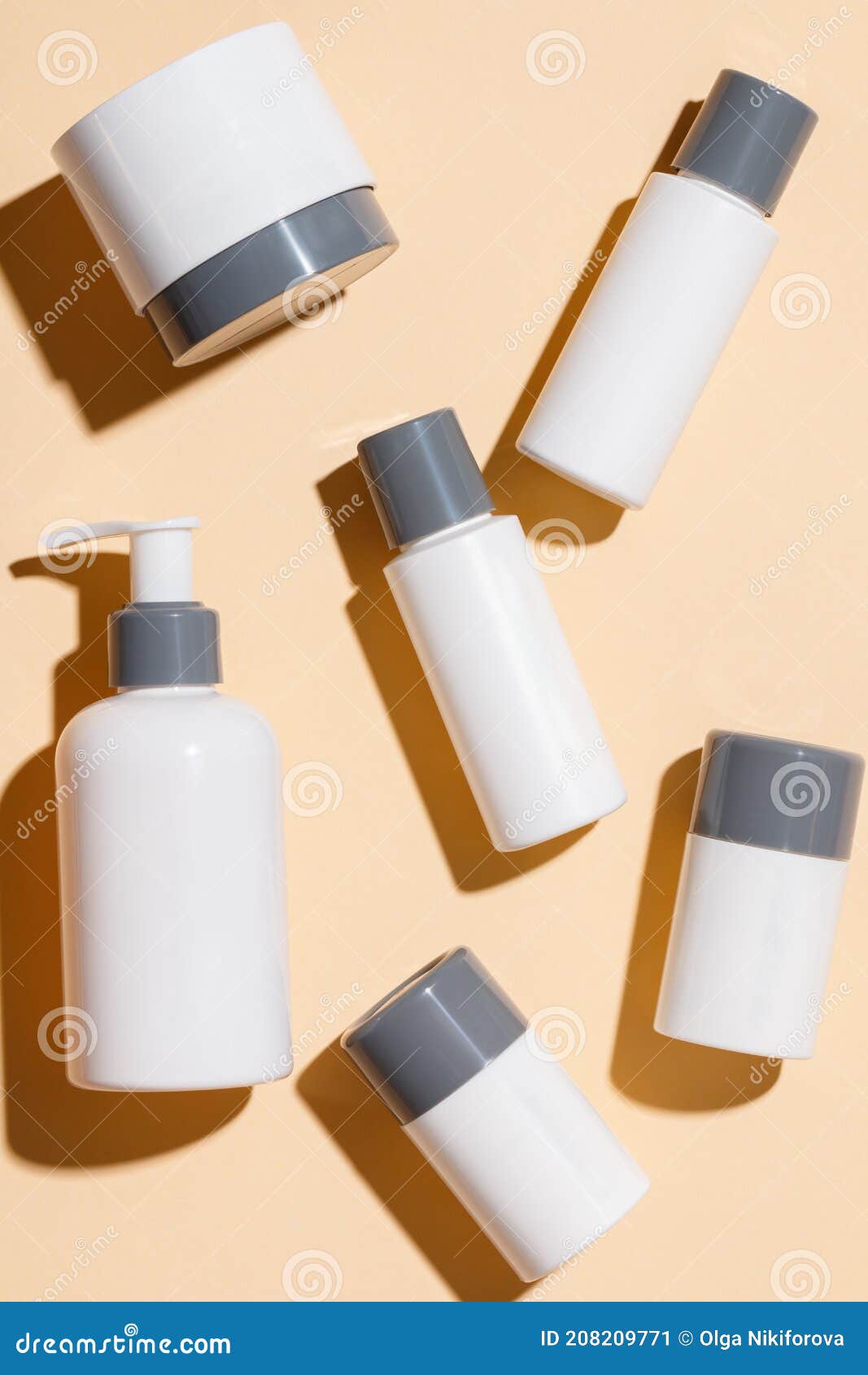 cosmetic products for skin care on a beige background. creams, serums, lotions with empty packaging. beauty and spa concept