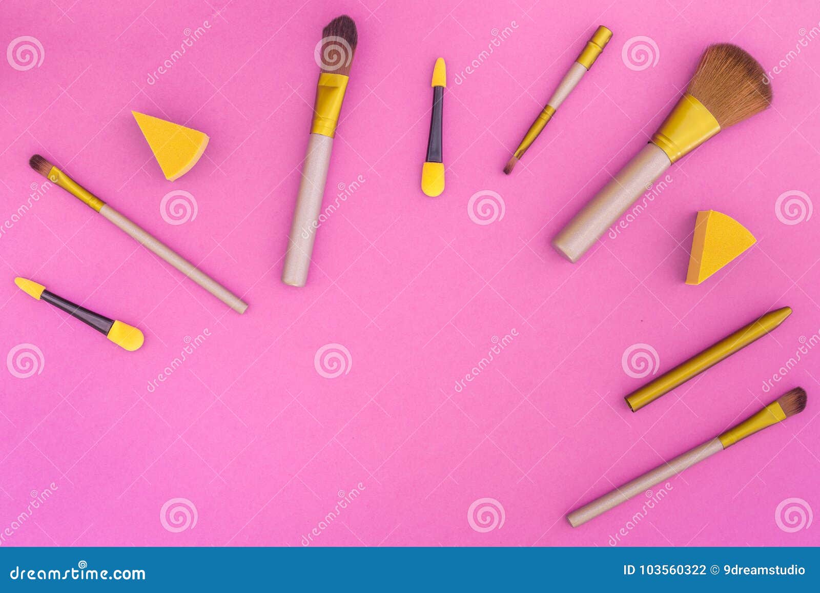 Cosmetics on Colorful Background. Set of Brushes for Makeup on Pink ...