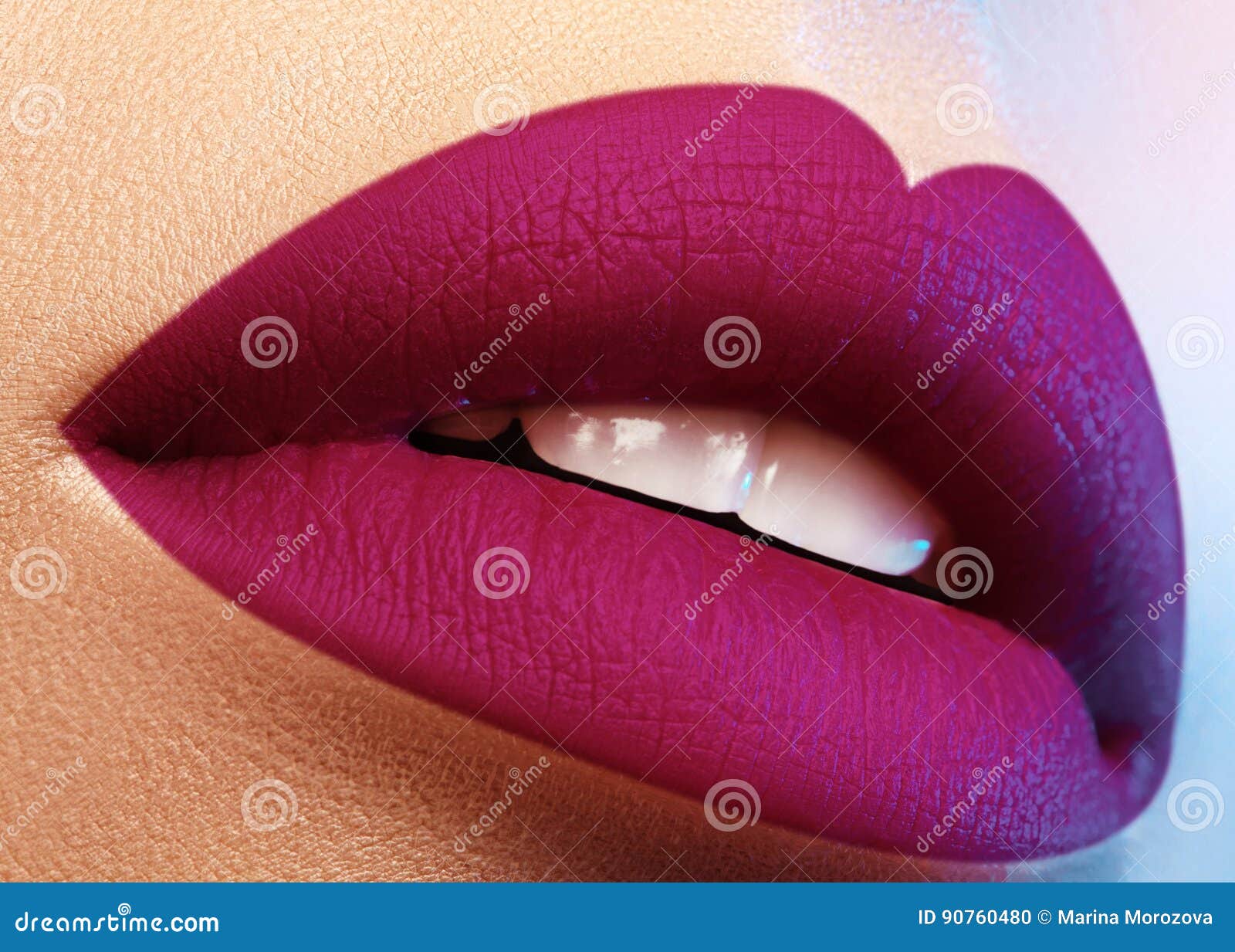 cosmetics, makeup. bright lipstick on lips. closeup of beautiful female mouth with purple lip makeup. part of face