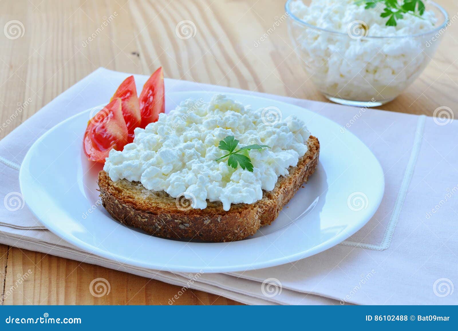 Cottage Cheese on a Slice of Wholemeal Bread with Tomatoes Stock Photo
