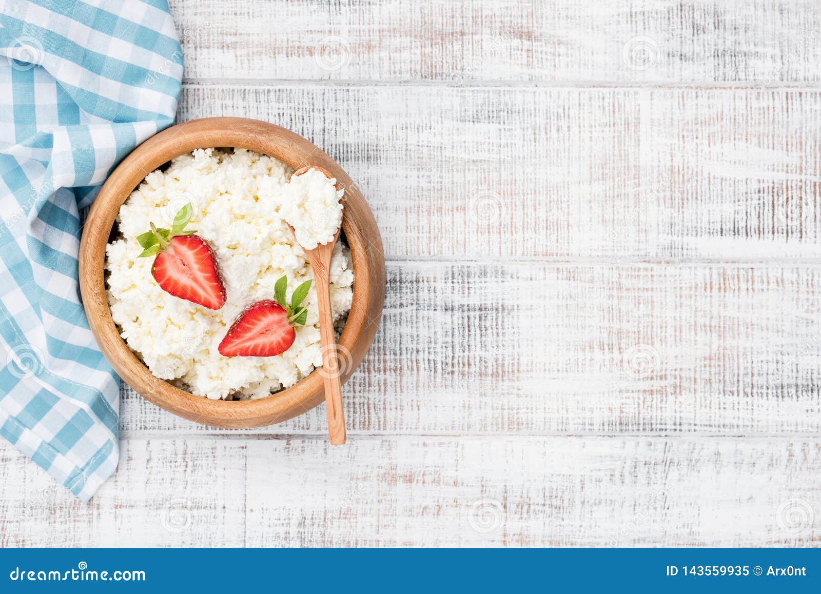 cottage cheese, tvorog or curd in wooden bowl