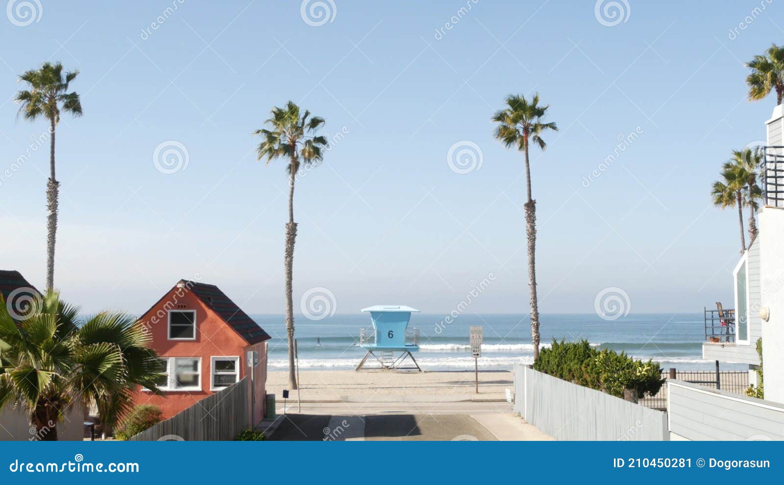 cottages in oceanside california usa. beachfront bungalows. ocean beach palm trees. lifeguard tower.