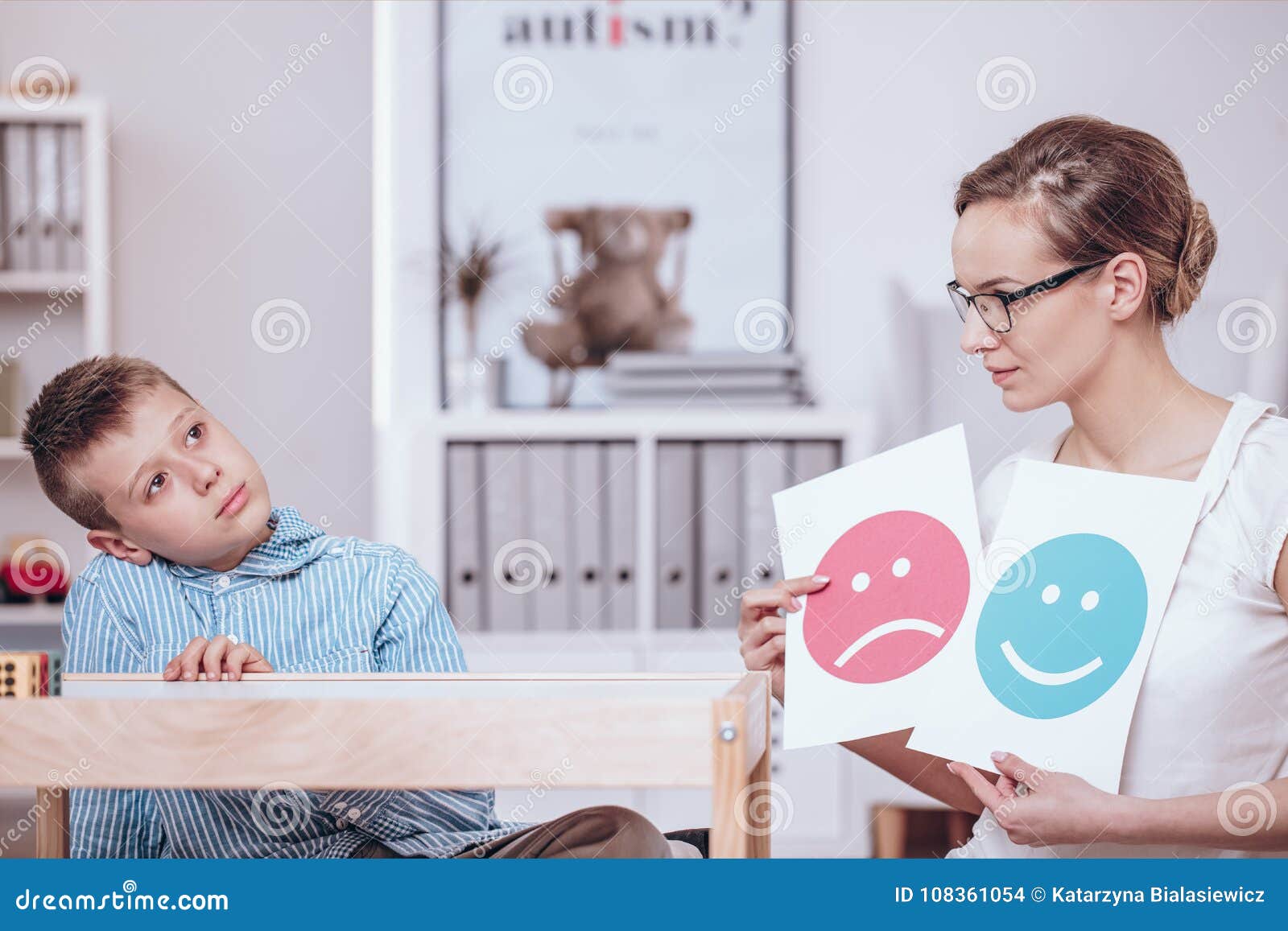 counselor teaching autistic kid