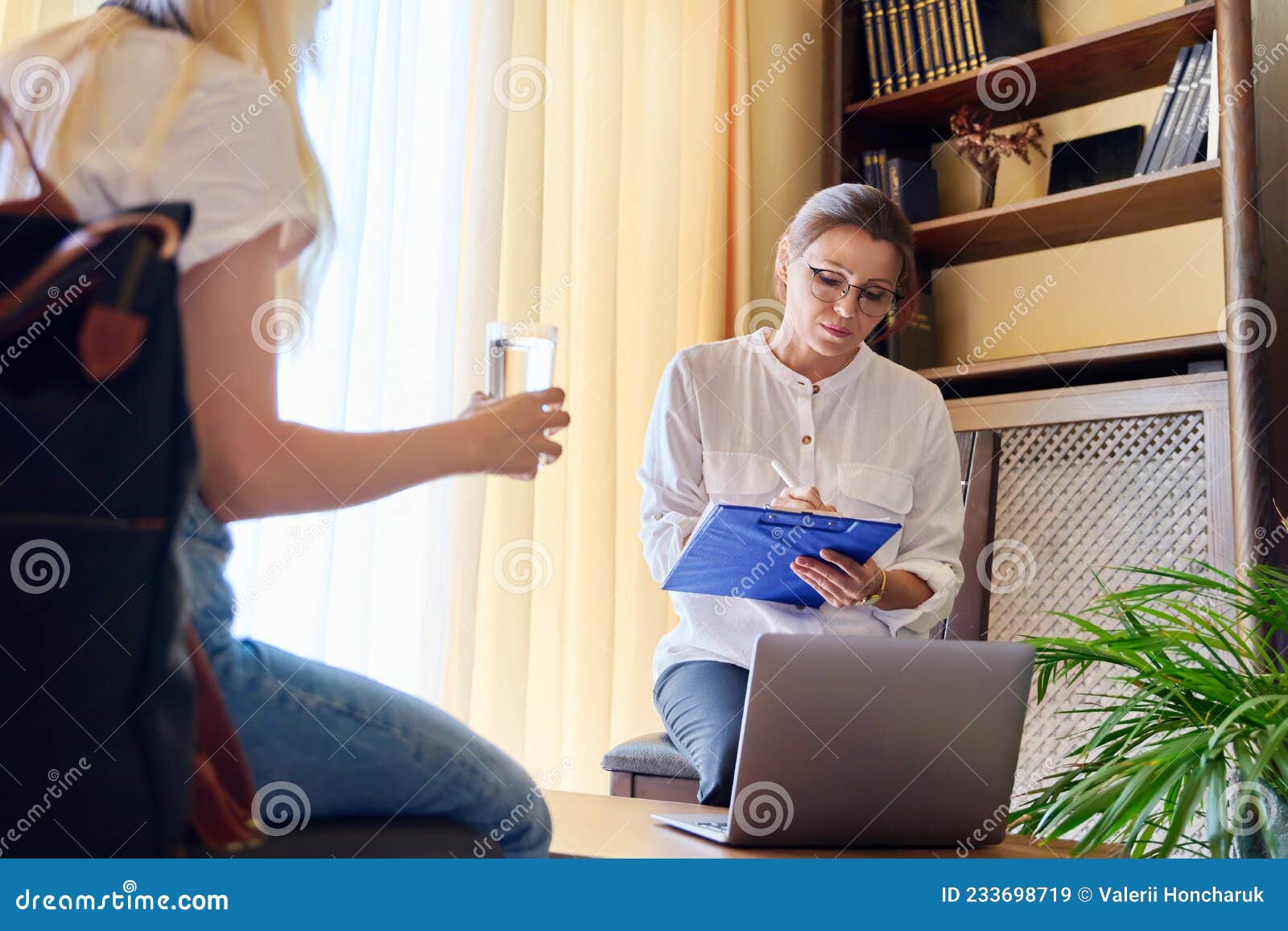 Counselor Social Worker Psychologist Advising A Female Teenager In The Office Stock Image