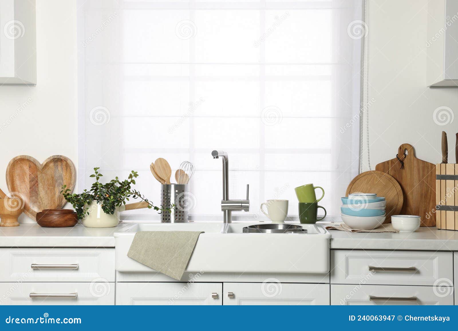 Countertop with Sink and Cooking Utensils in Kitchen Stock Image