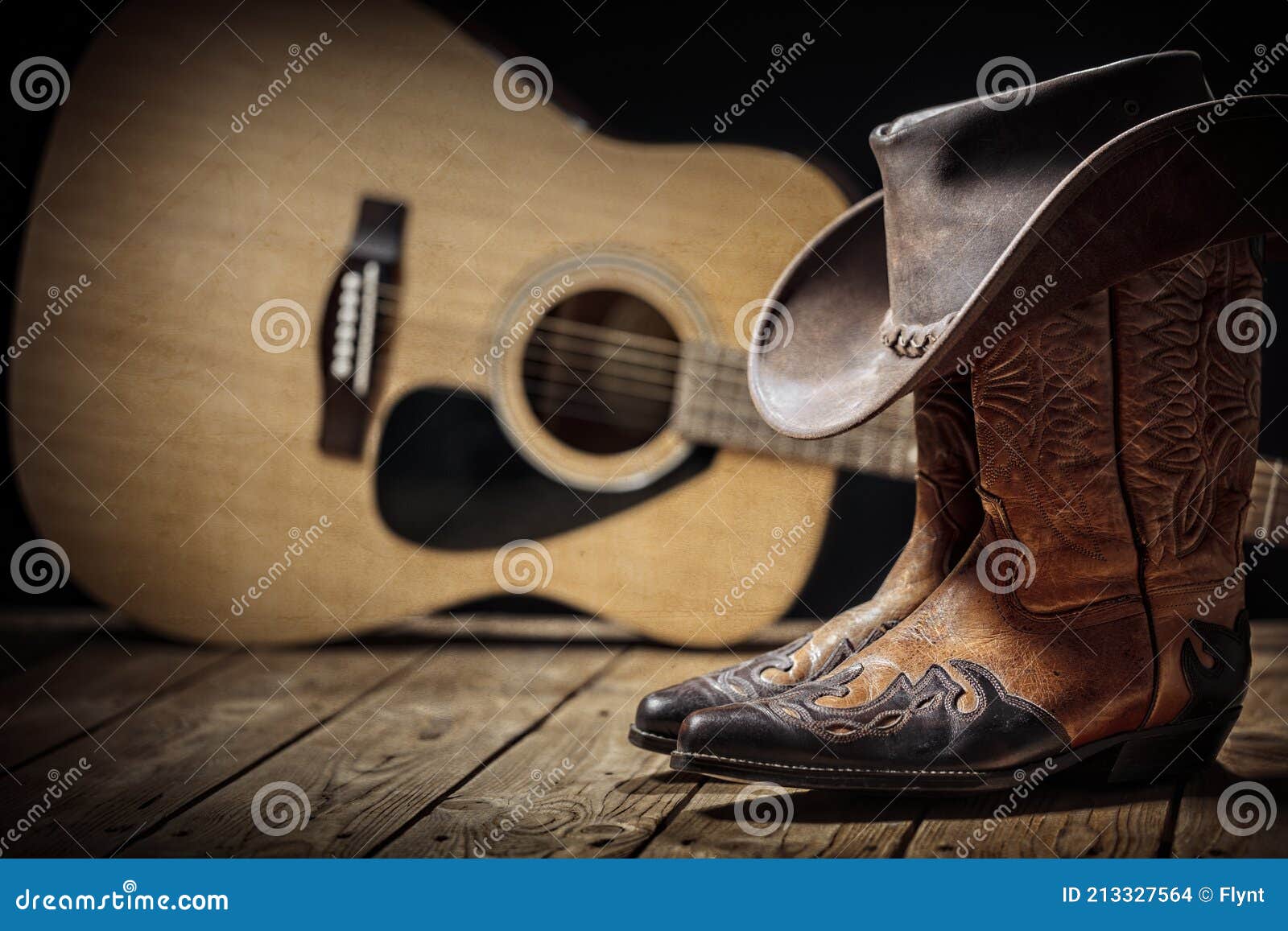 country music festival live concert with acoustic guitar, cowboy hat and boots