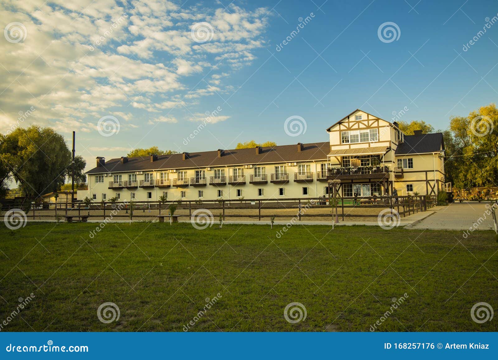 country side rancho and hotel rural building apartment landscaping with with green grass meadow foreground