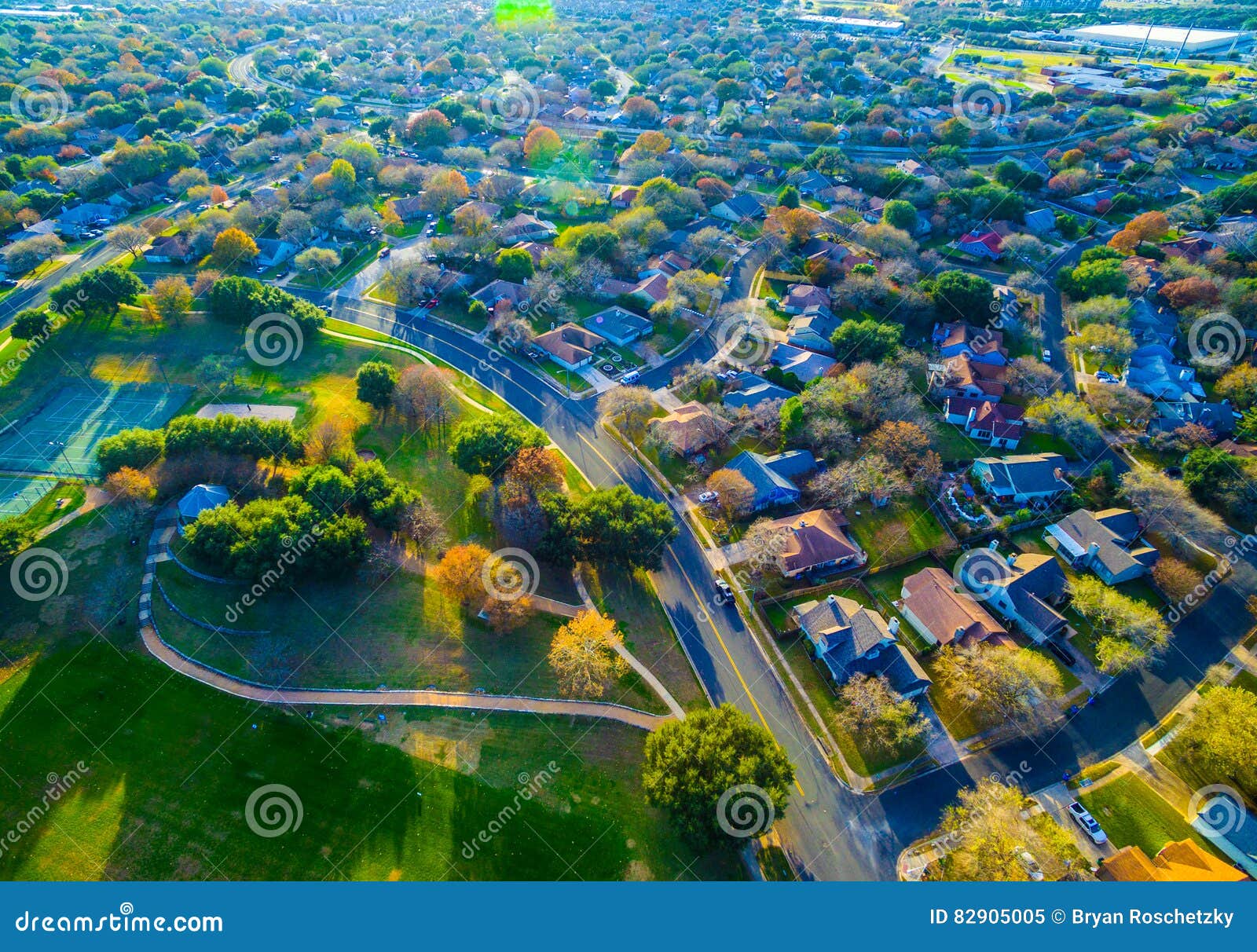 country side suburb homes austin texas aerial drone shot above community with hiking trails