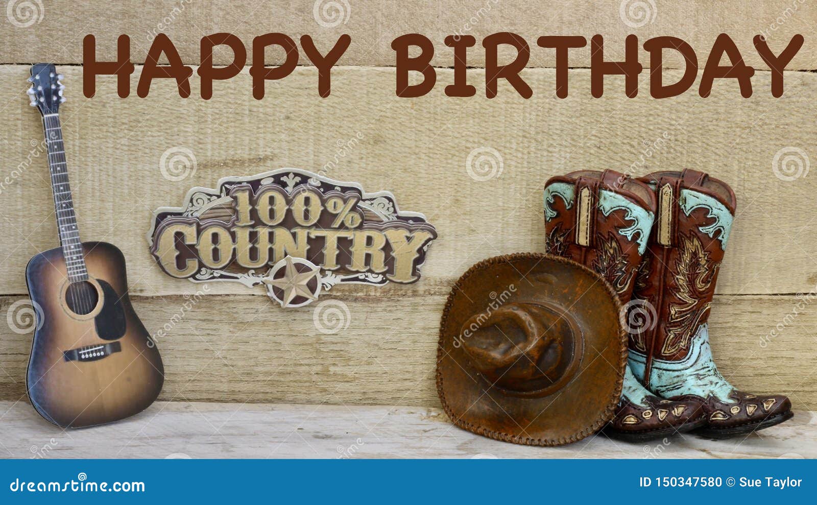 Cowboy boots hat and guitar standing on a wood background with happy birthd...
