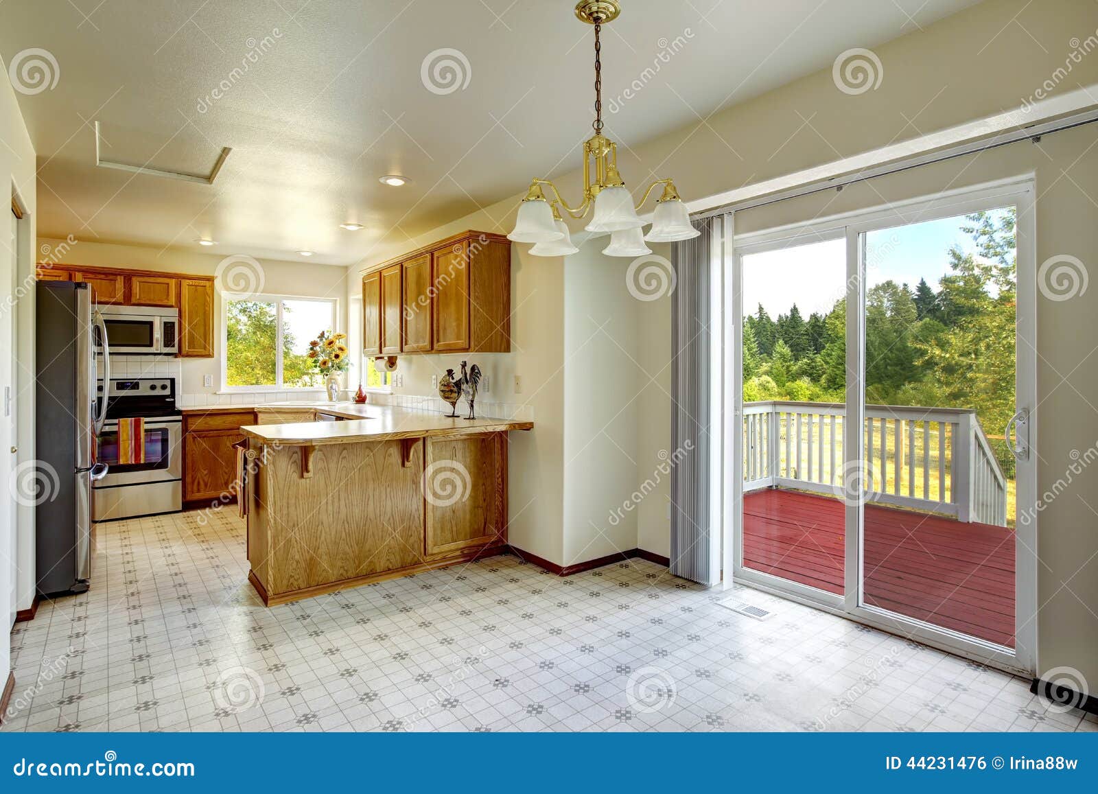 countryside house interior. bright kitchen room with walkout dec