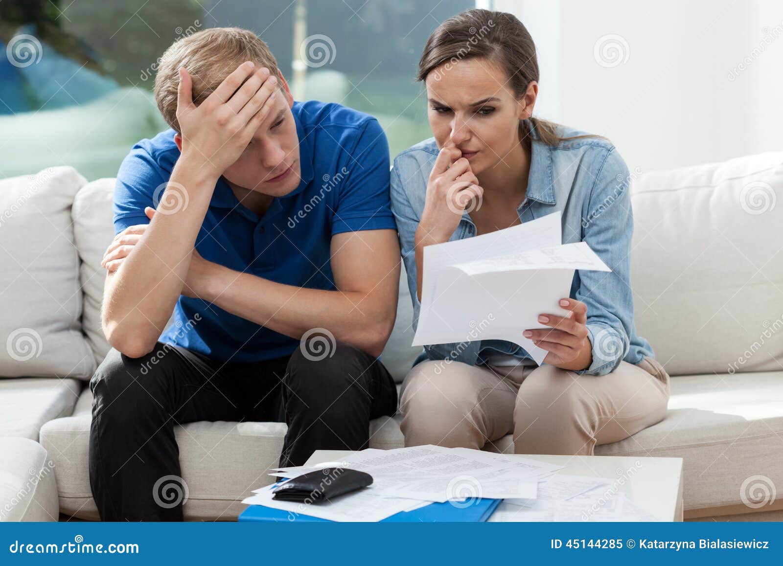 couple analyzing family bills