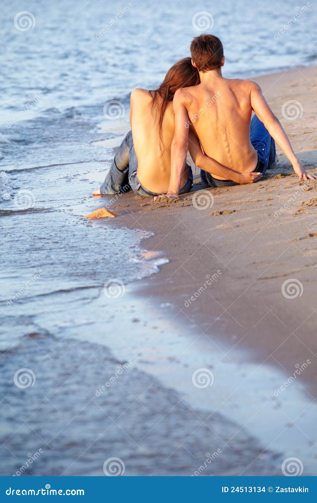 Couple at the beach stock photo pic