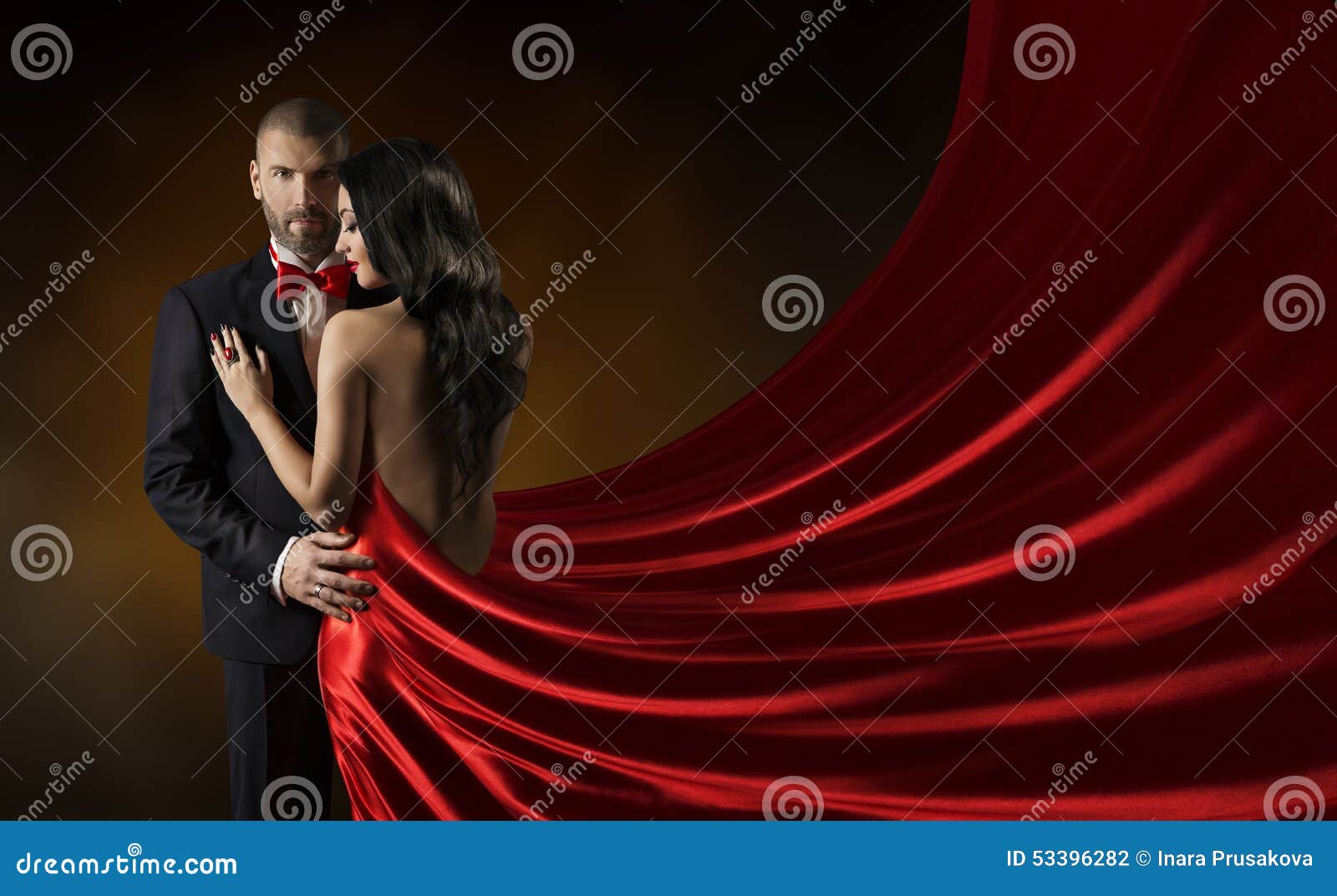couple beauty portrait, man in suit woman red dress, rich gown
