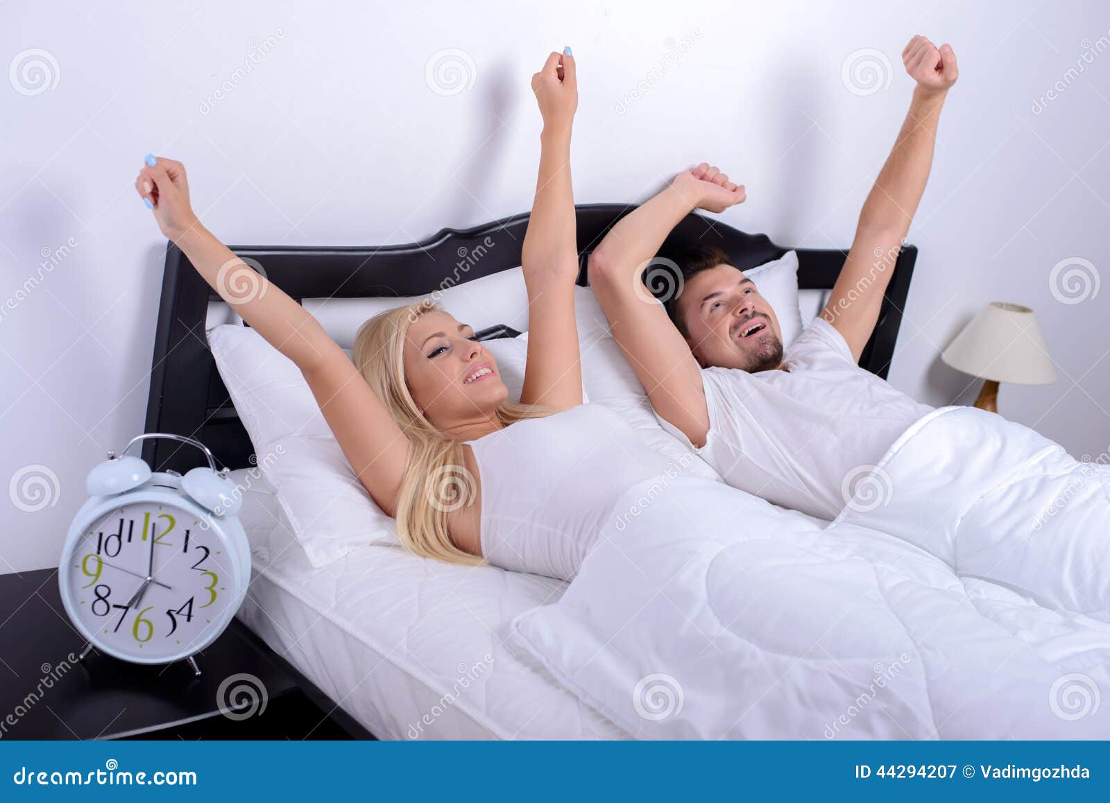 Couple in bed stock image. Image of happy, morning, clock - 44294207