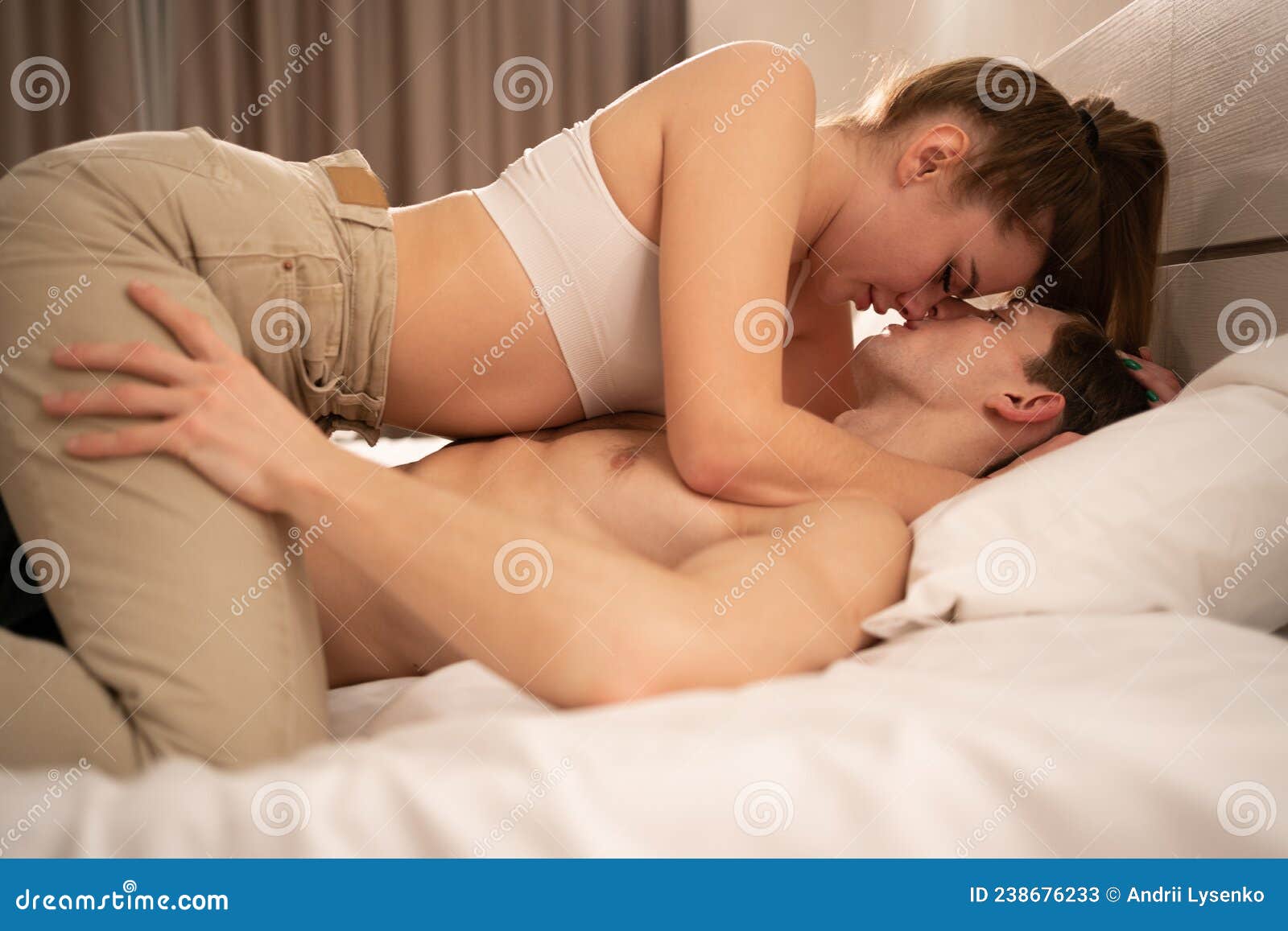 Couple in Bed Makes Love, Woman Kissing a Man Sitting on Top, Lovers  Foreplay of Love, Intimate Meeting in the Bedroom Stock Image - Image of  foreplay, erotic: 238676233