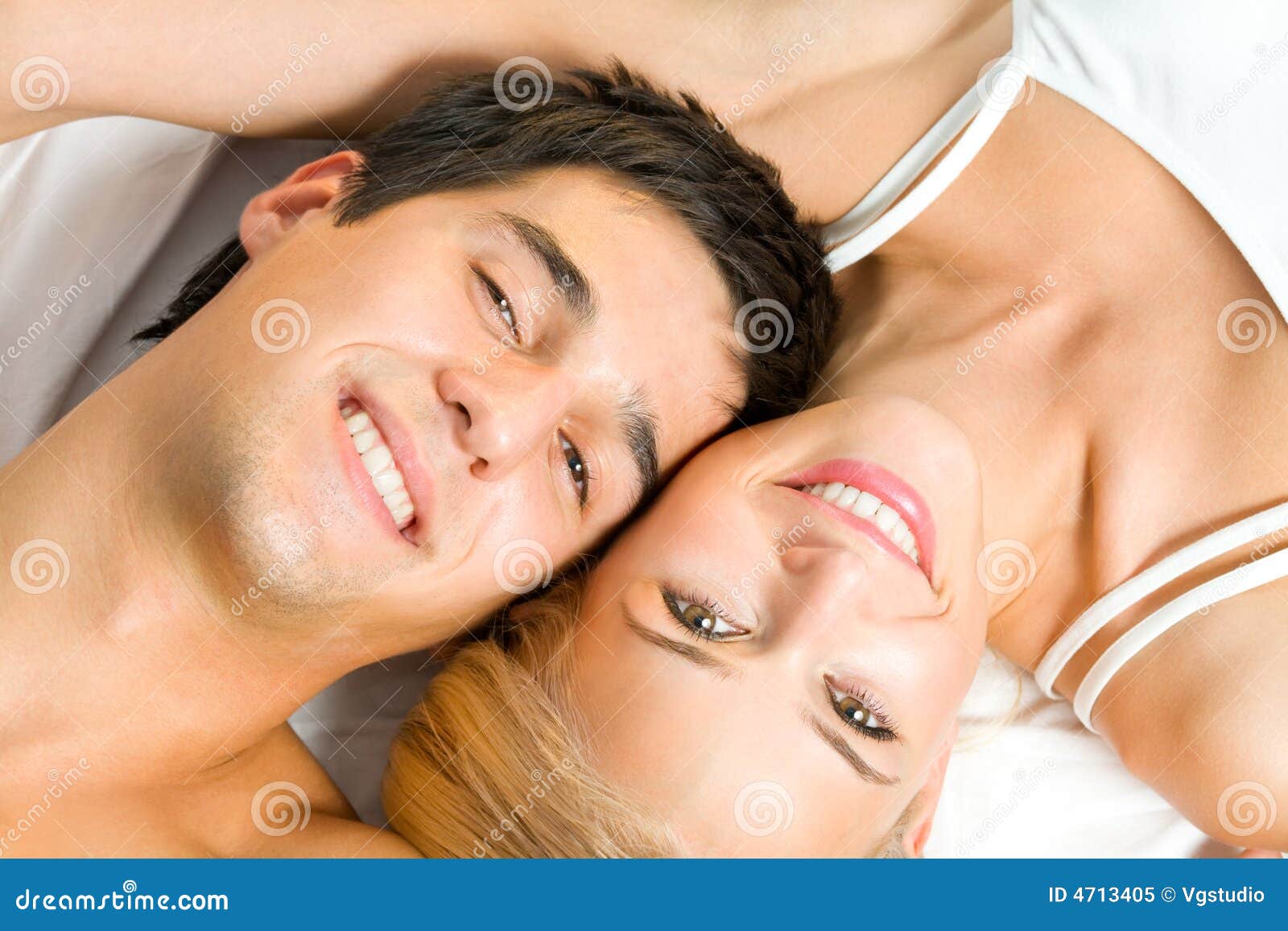 Happy amorous couple at bedroom