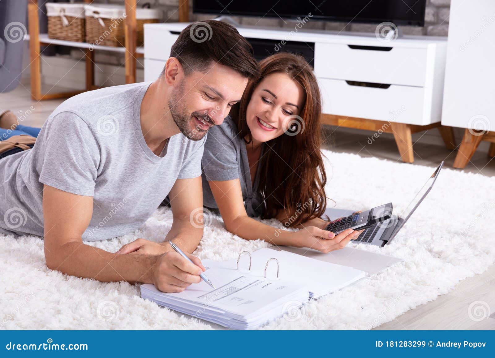 Couple Calculating Invoice with Calculator Stock Image Image of