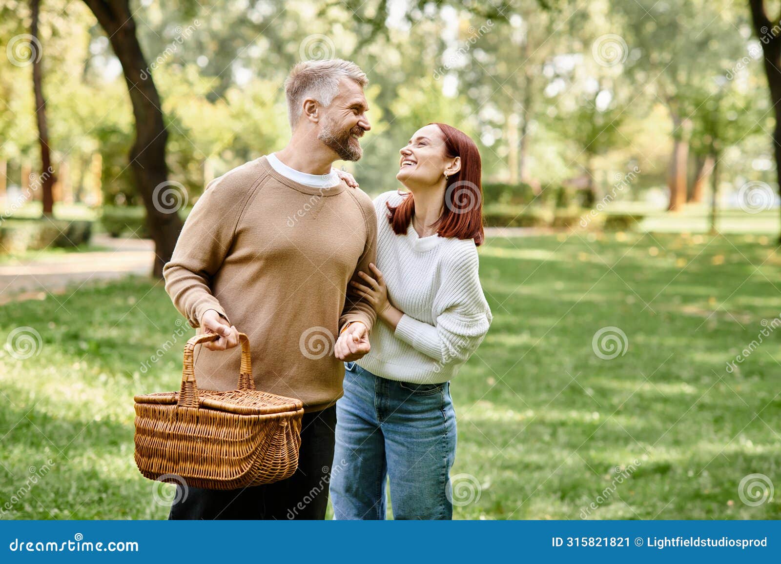 a couple, casually dressed, leisurely walk