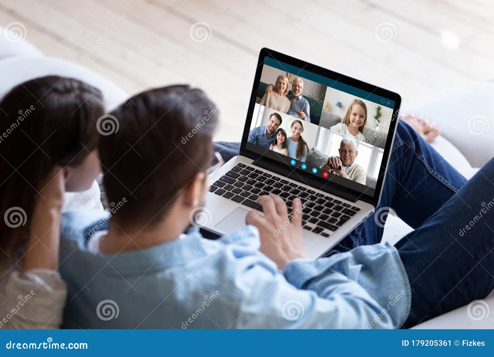 couple chatting with relatives via videoconference video call application