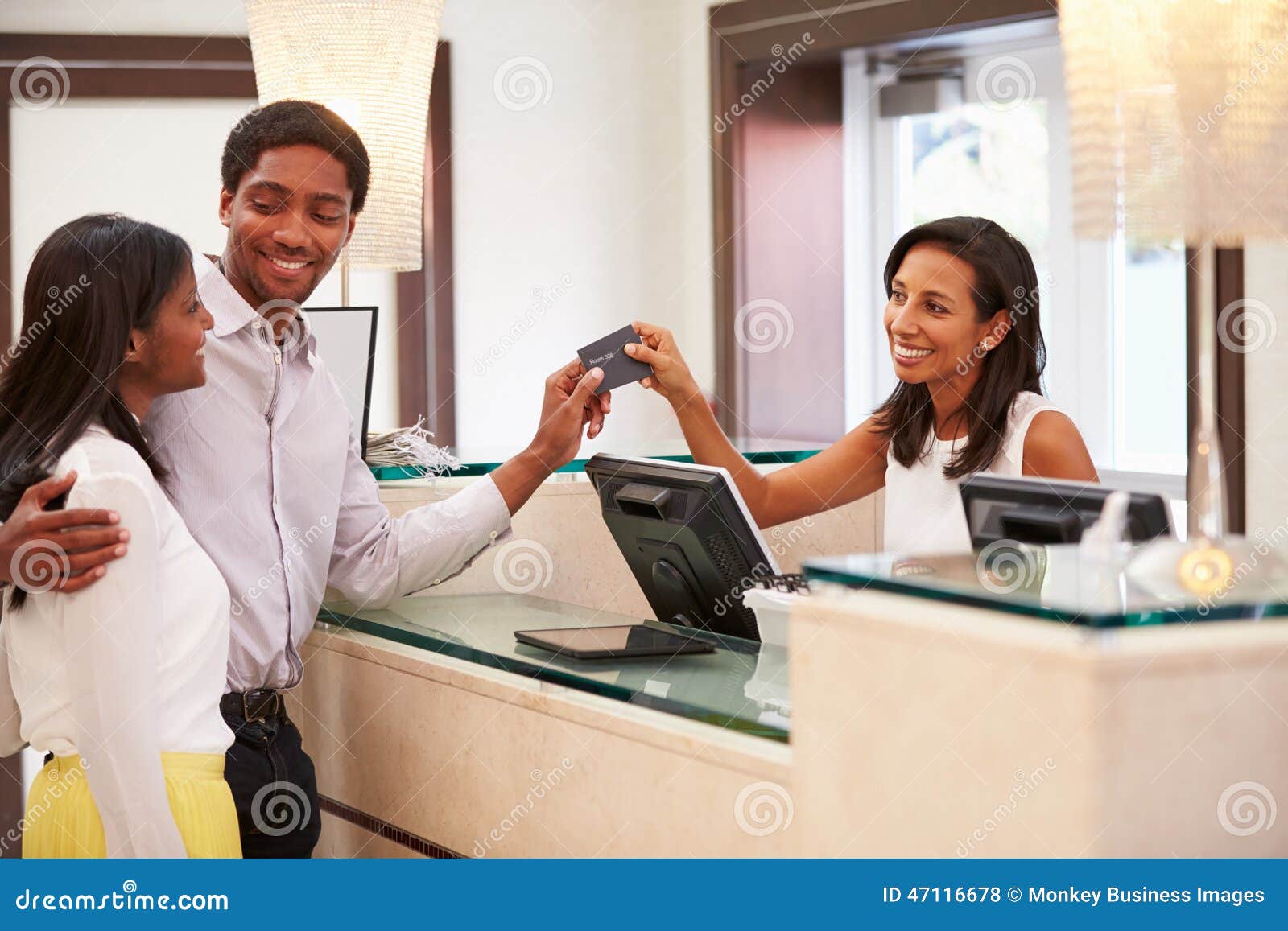 Couple Checking In At Hotel Reception Stock Photo Image Of Female