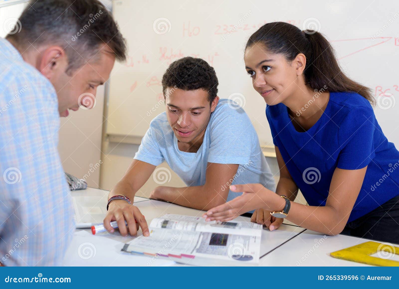 Couple Choosing Kitchen Furniture and Getting Quotation Stock Photo