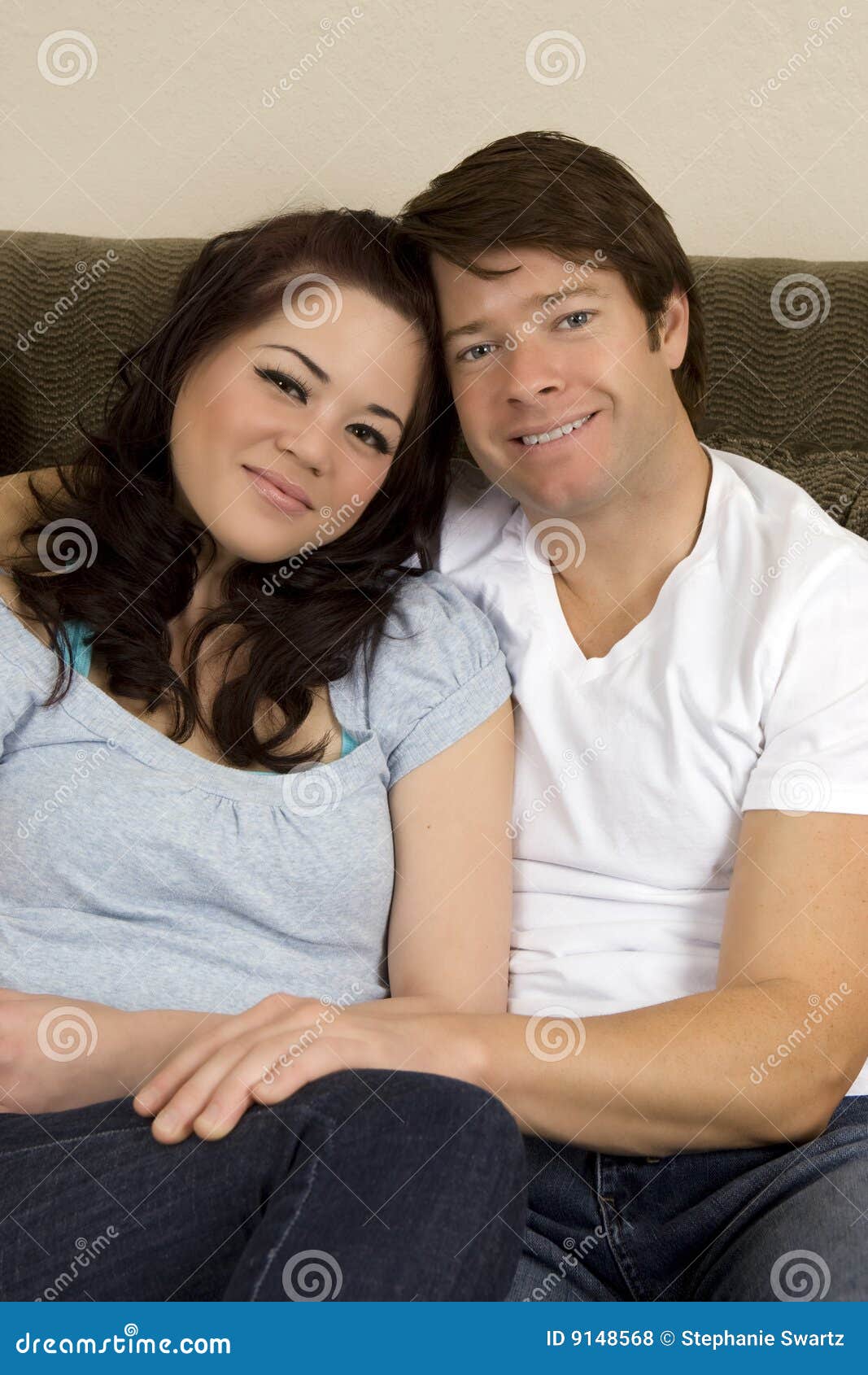 Couple on couch stock photo. Image of cuddle, handsome 9148568