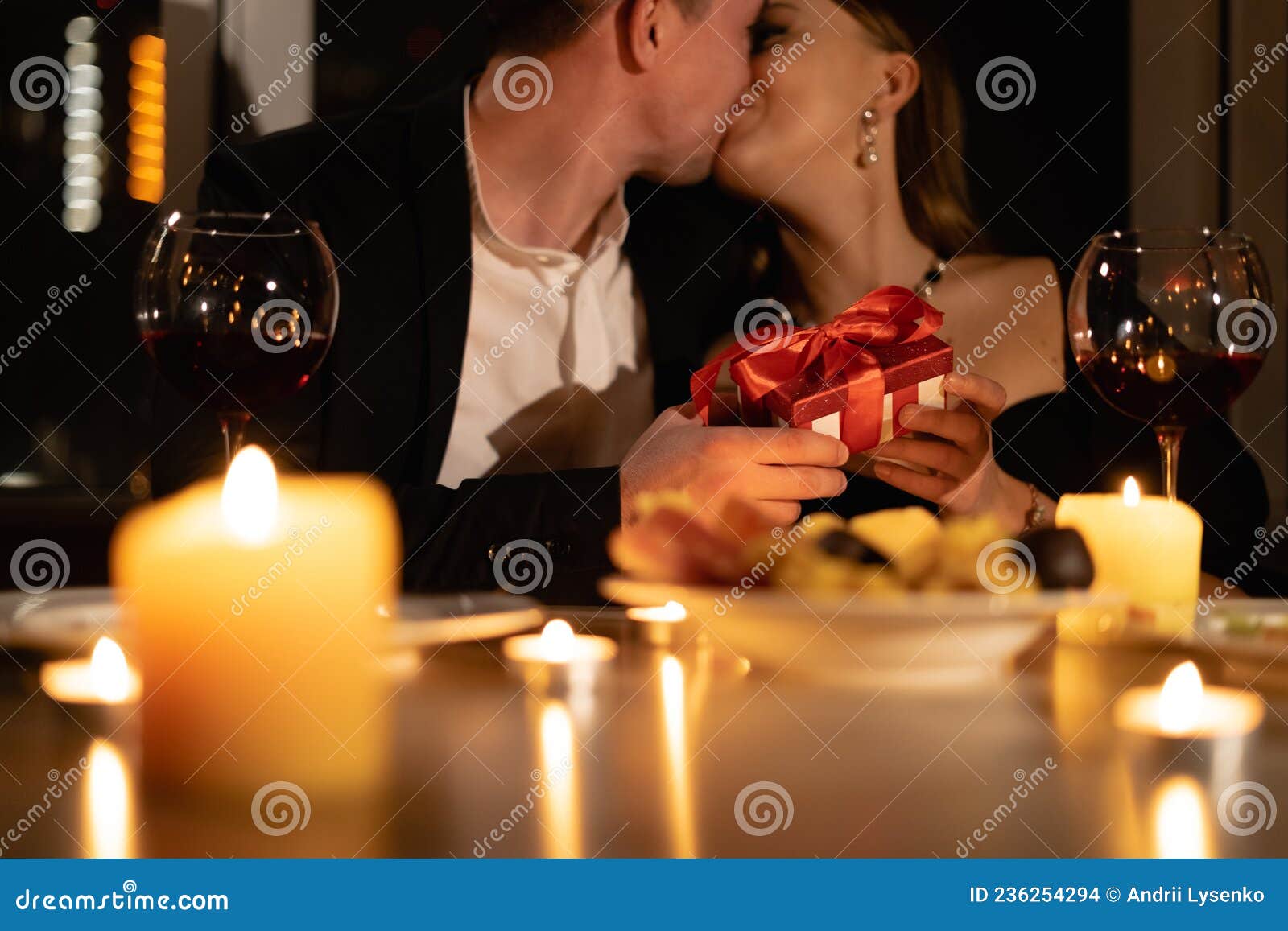 Romantic Couple Kissing with Gift by Christmas Tree Stock Photo | Adobe  Stock-hdcinema.vn