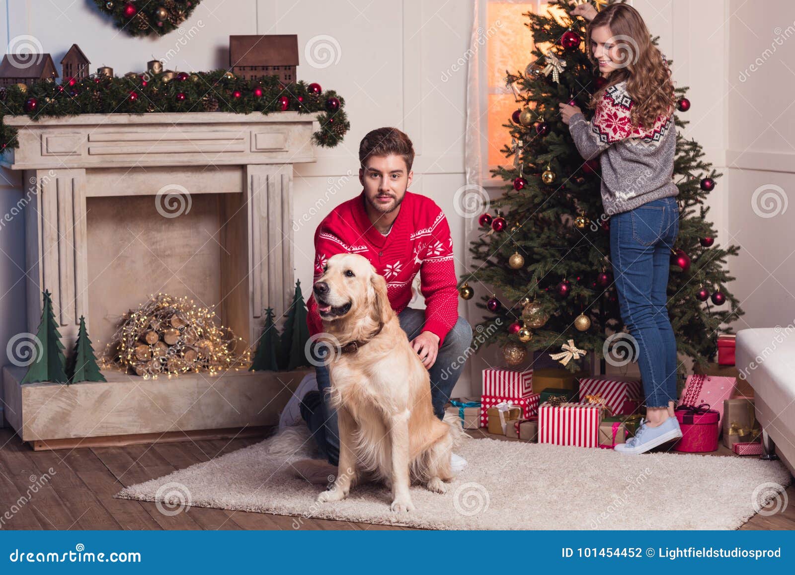 Couple with Dog at Christmastime Stock Photo - Image of adult, holiday