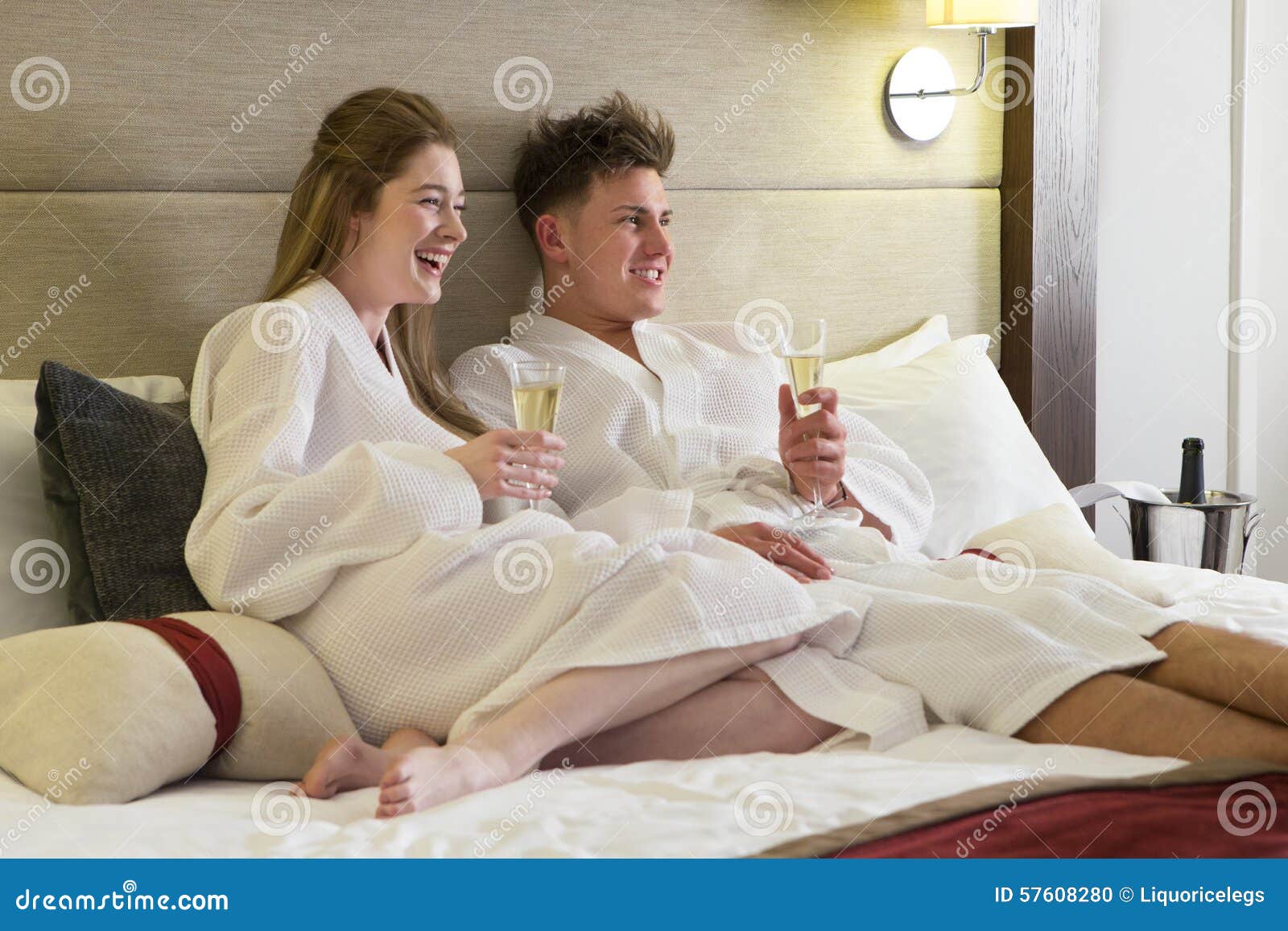 Couple Enjoying A Drink In Hotel Room Stock Photo Image Of Lying
