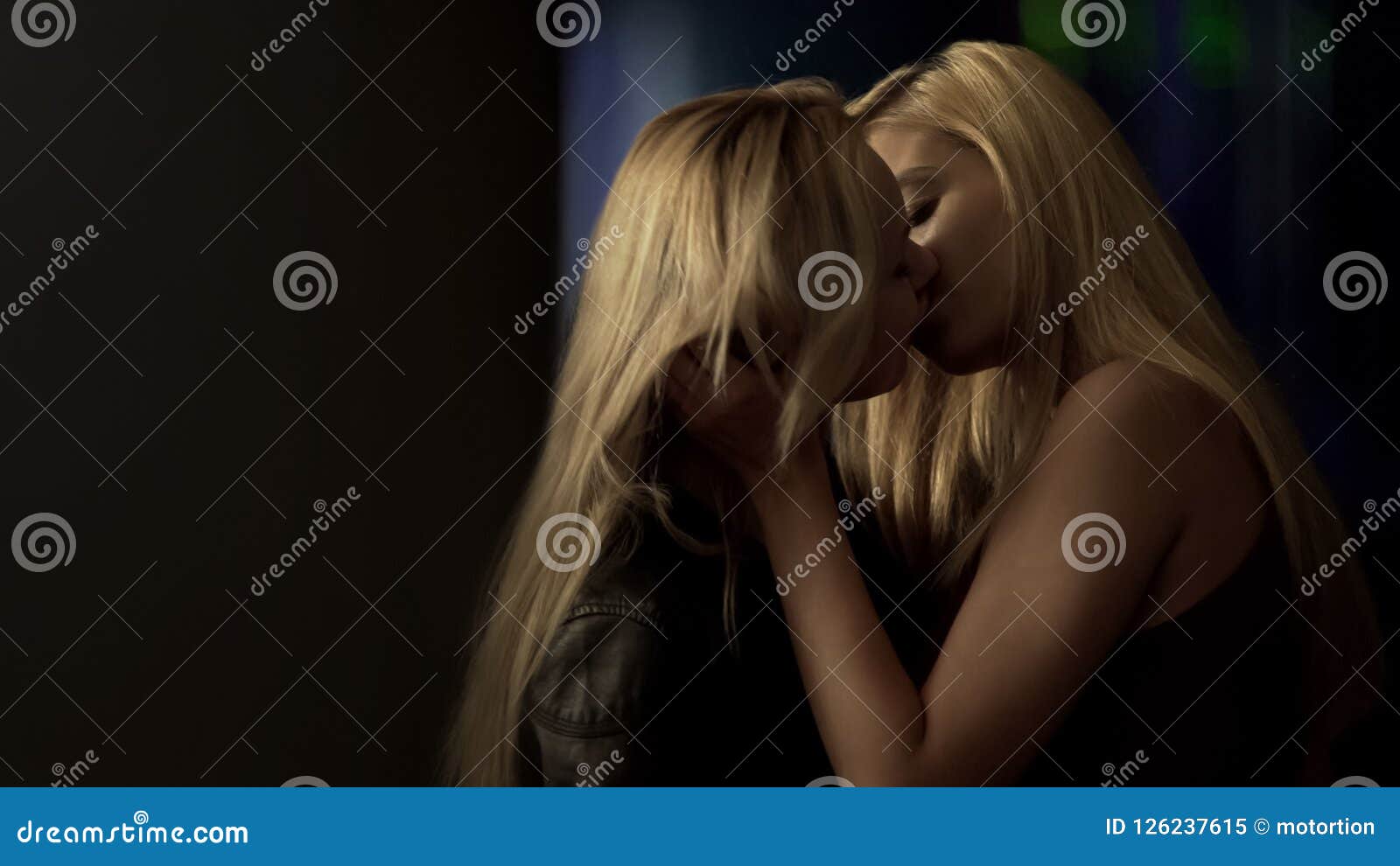 Couple Of Excited Lesbians Kissing Passionately In Dark Street