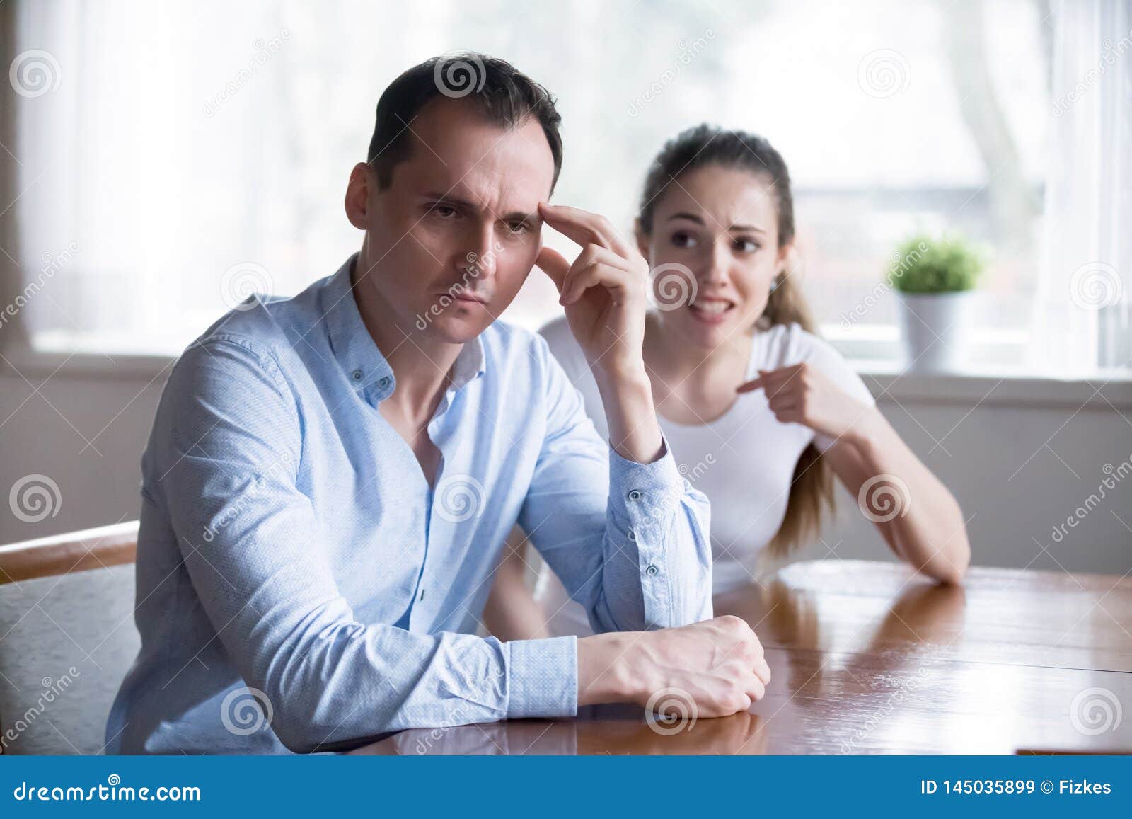 couple-fight-man-focus-depressed-husband-headache-ignoring-screaming-irritated-woman-big-trouble-problem-145035899.jpg