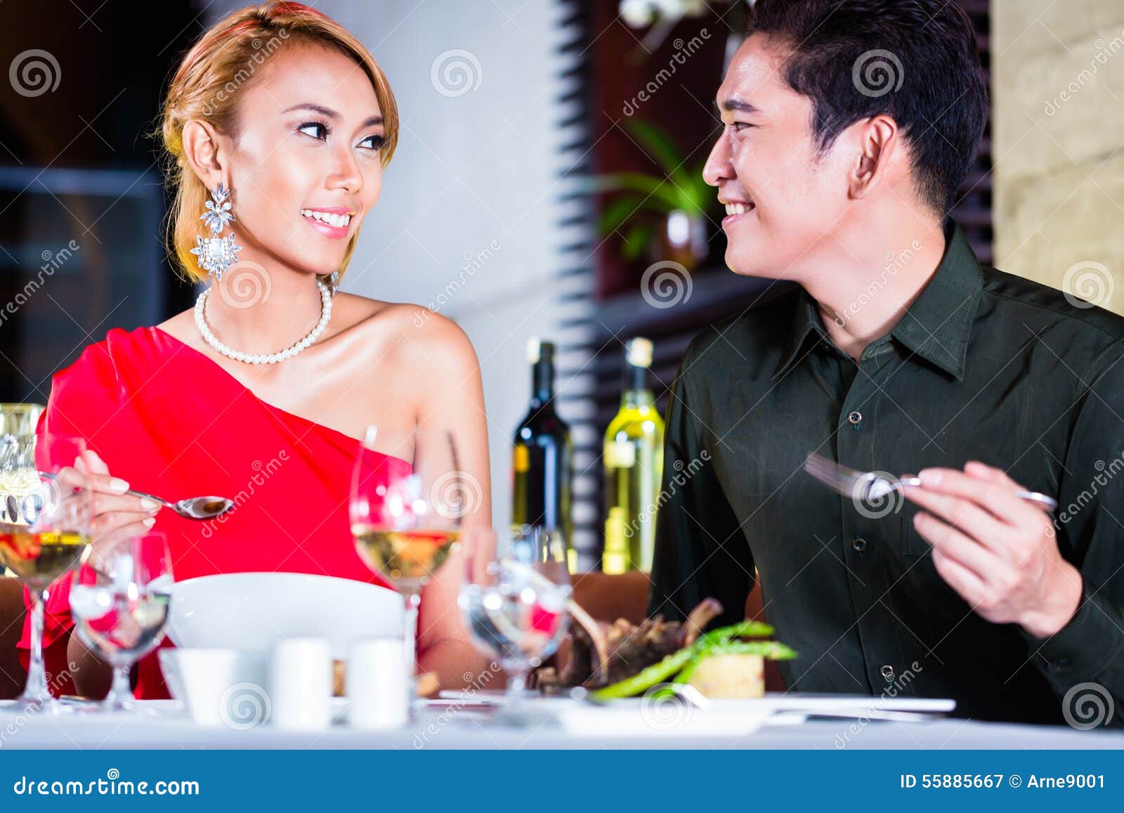 couple fine dining in fancy restaurant