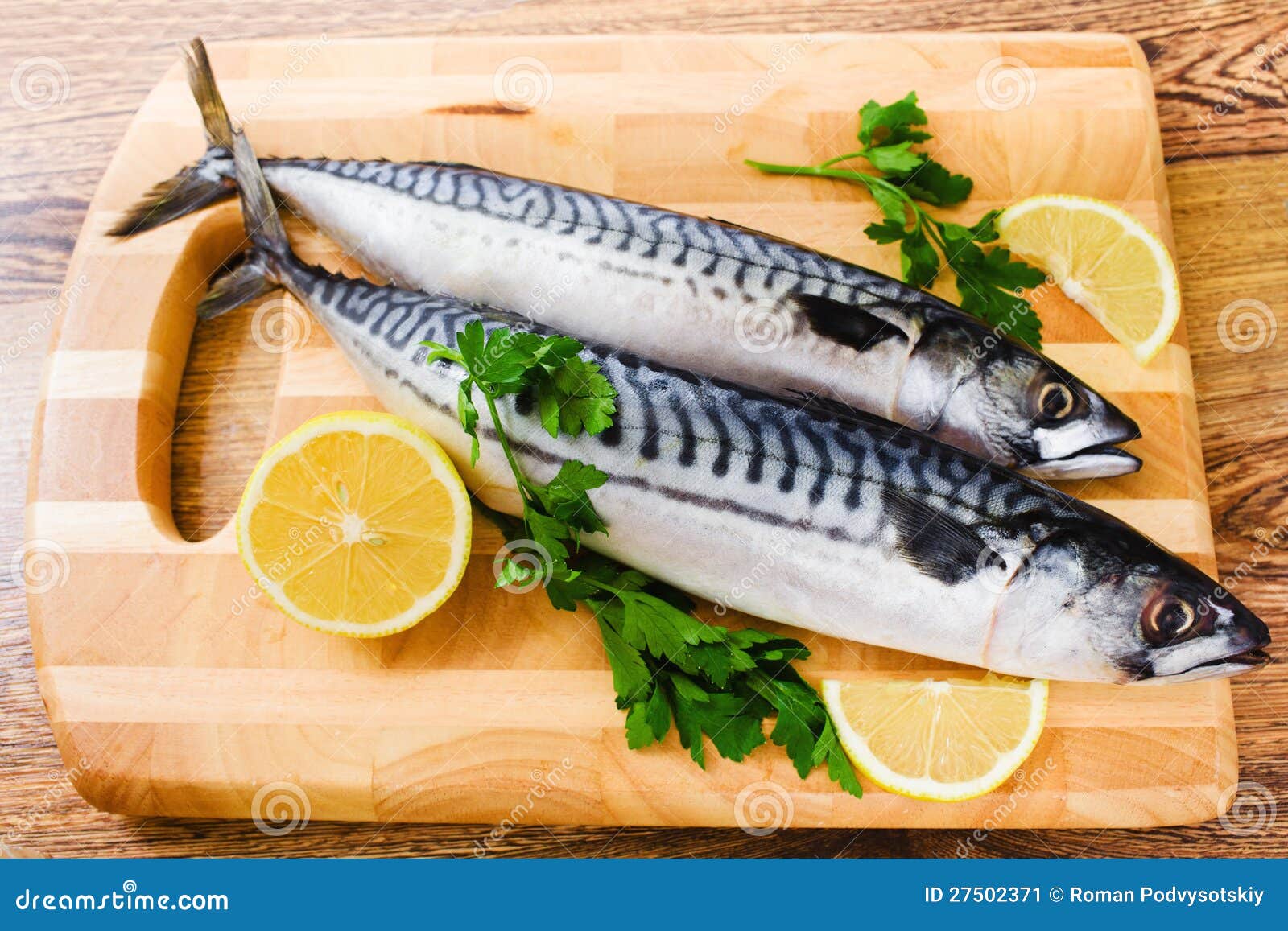 Fresh Mackerel Fish With Lemon And Spices Served On Silver Plate From