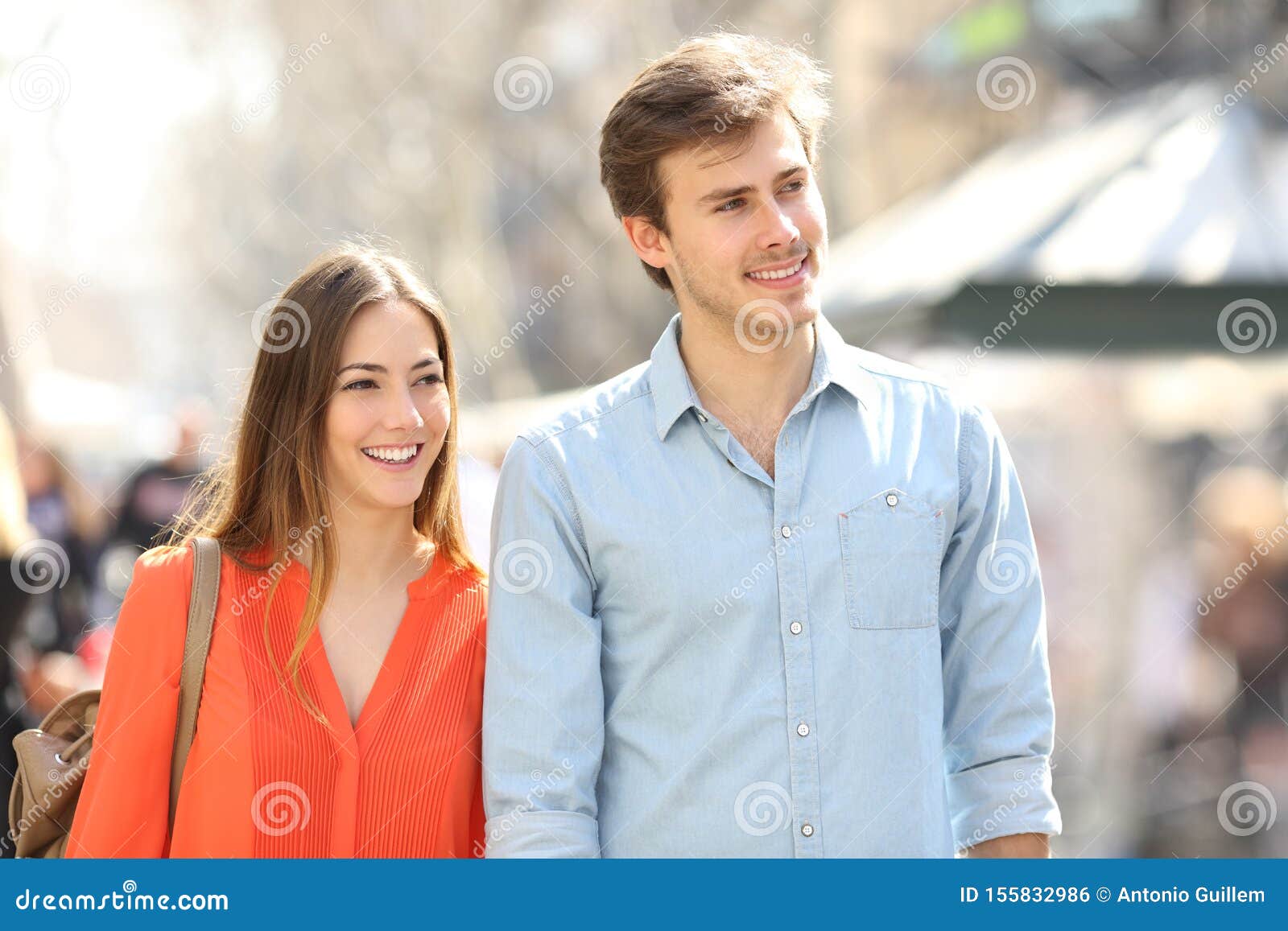 Couple or Friends Walking in the Street Looking at Side Stock Photo ...