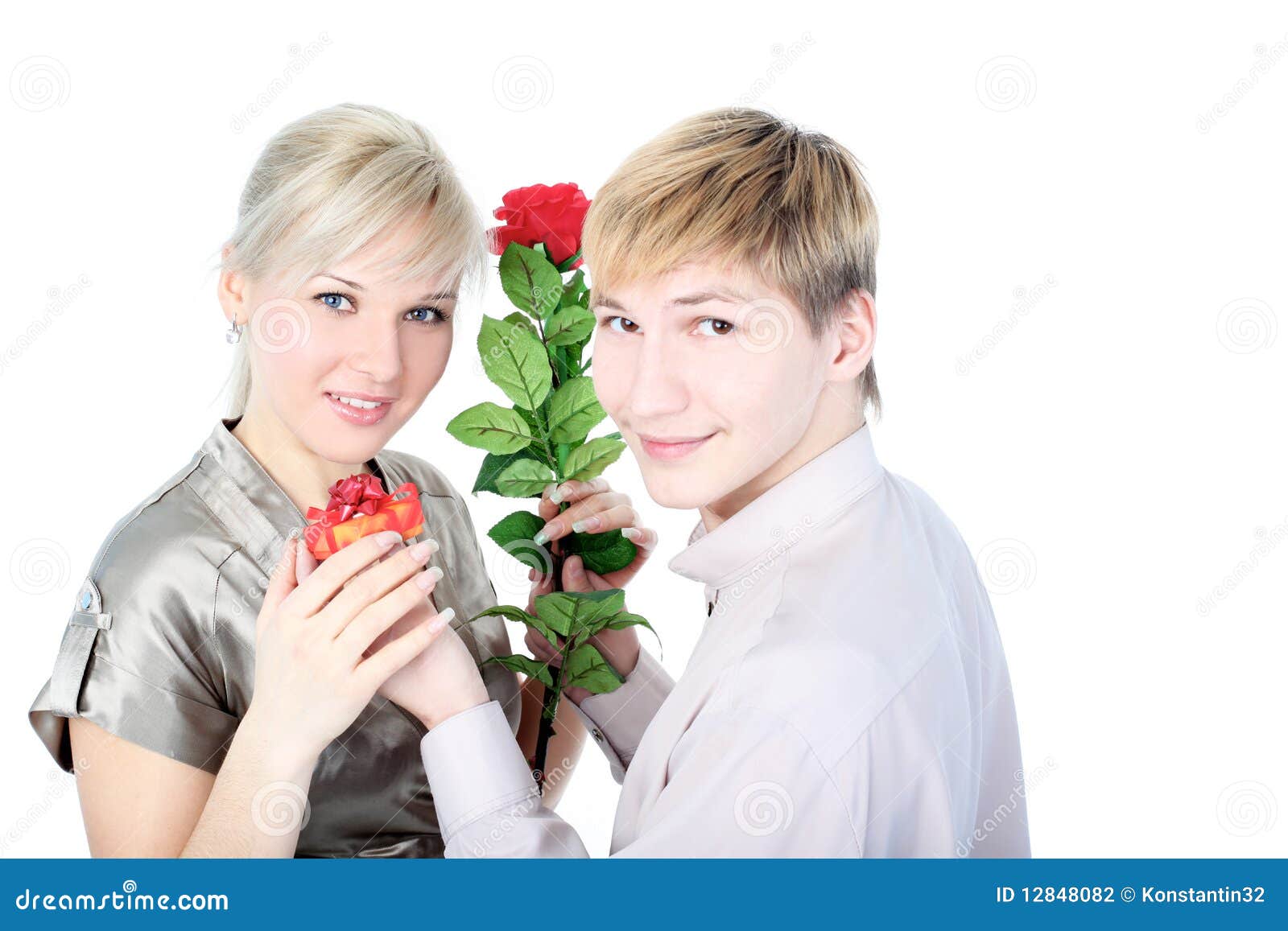 Couple with gift and flower isolated on white