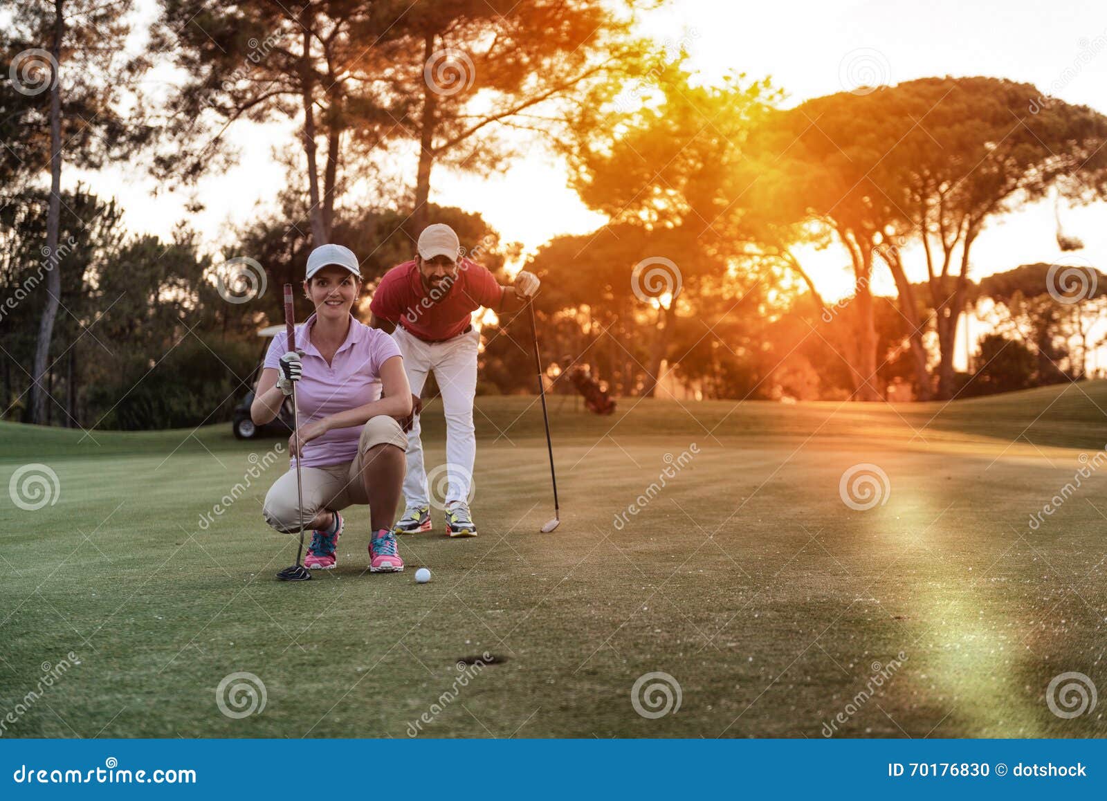 Couple on Golf Course at Sunset Stock Photo Image of grass, looking 70176830